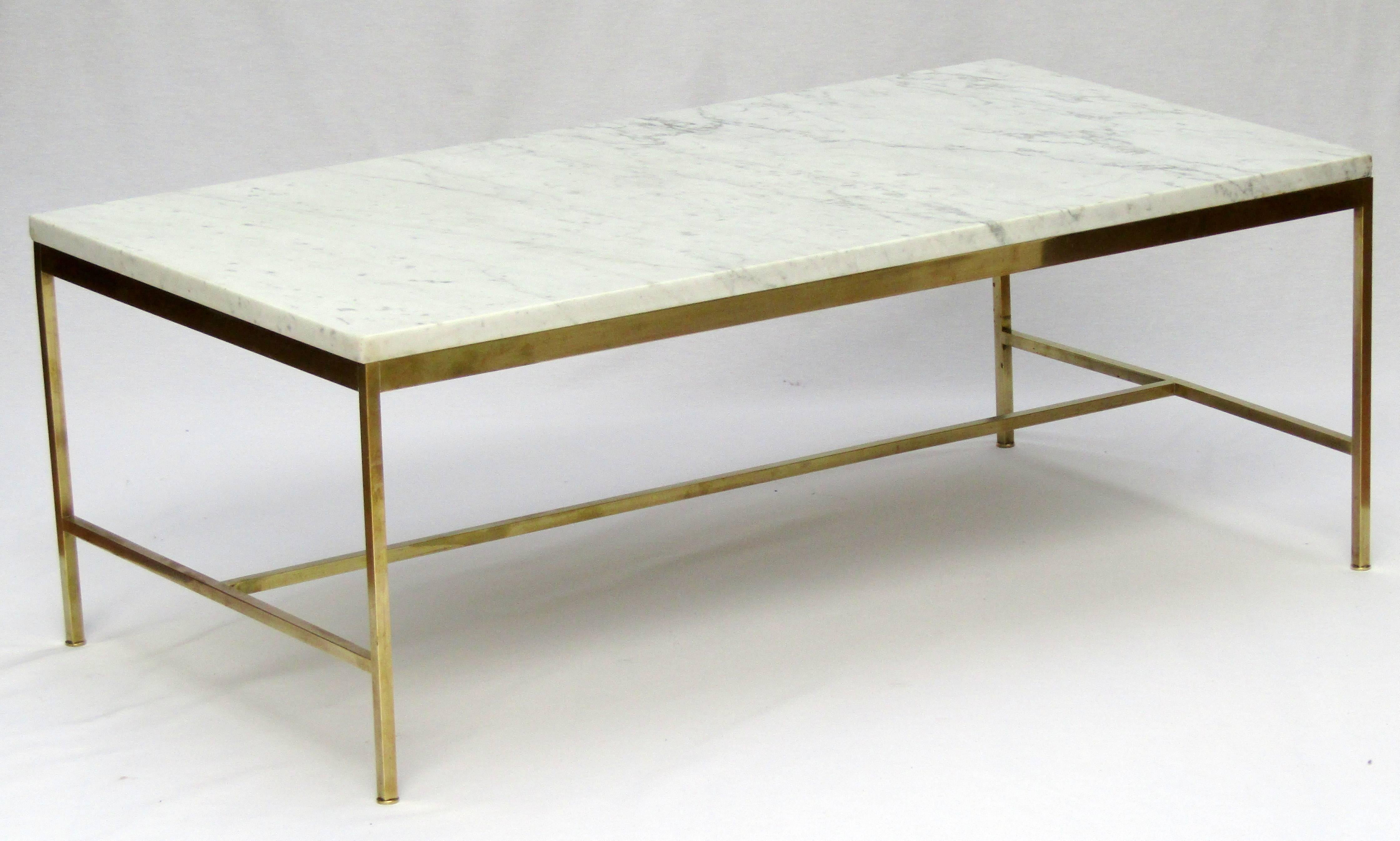 A white Carrara marble and brass coffee table
from the Directional Furniture Collection
designed by Paul McCobb.
    