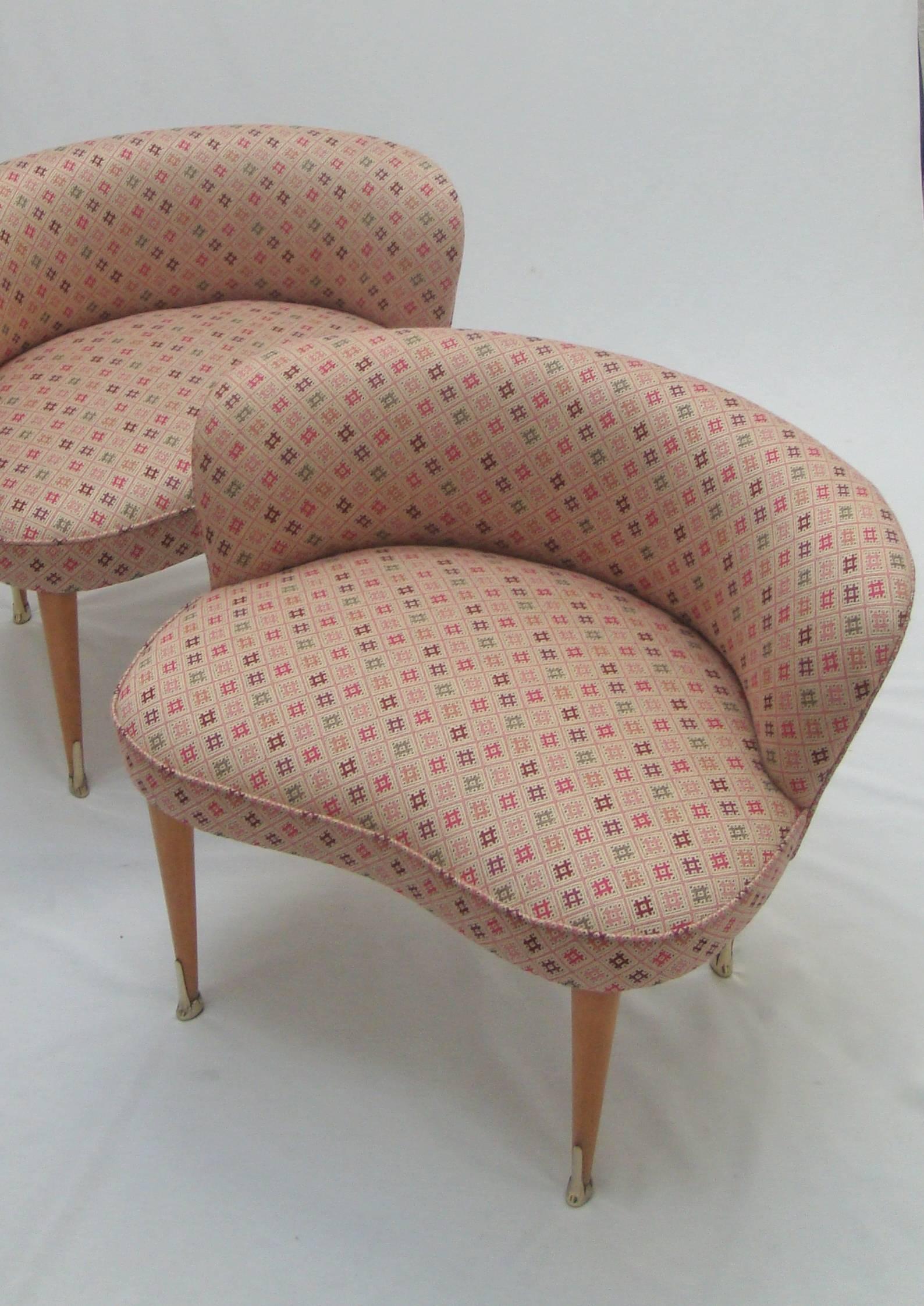 A pair of large low back stools with brass sabots upholstered
in Nina Campbell for Osborne and Little Jacquet fabric.
    
   