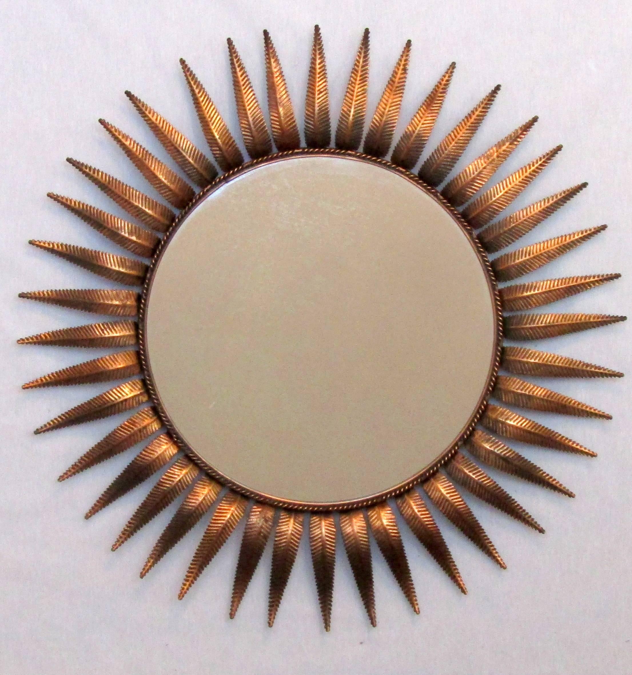 A copper sunburst mirror.
 