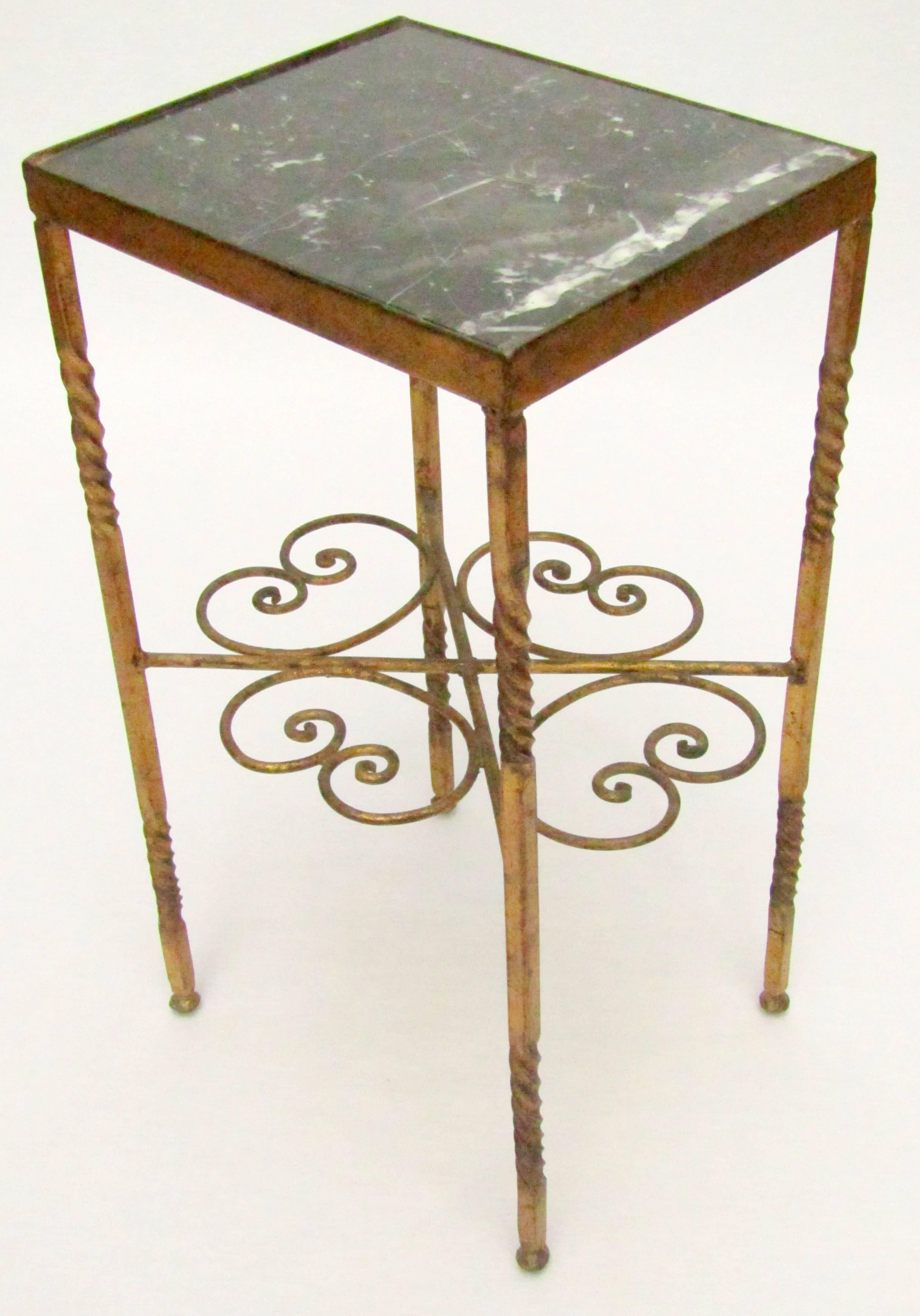 A gilded metal and marble Martini table.
 