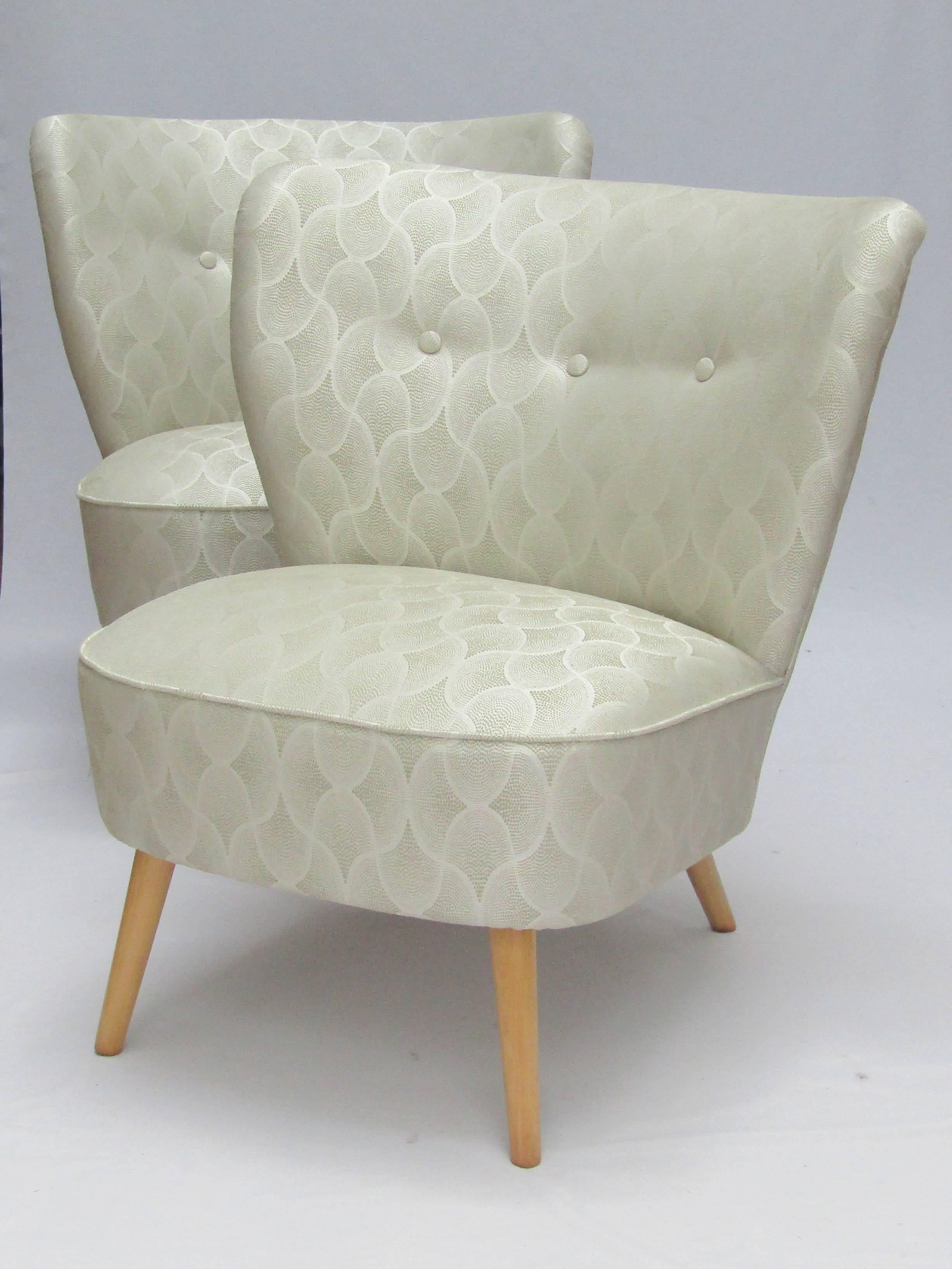 A pair of cocktail chairs
upholstered in Osborne and Little Tramonti fabric (colour 03).
 