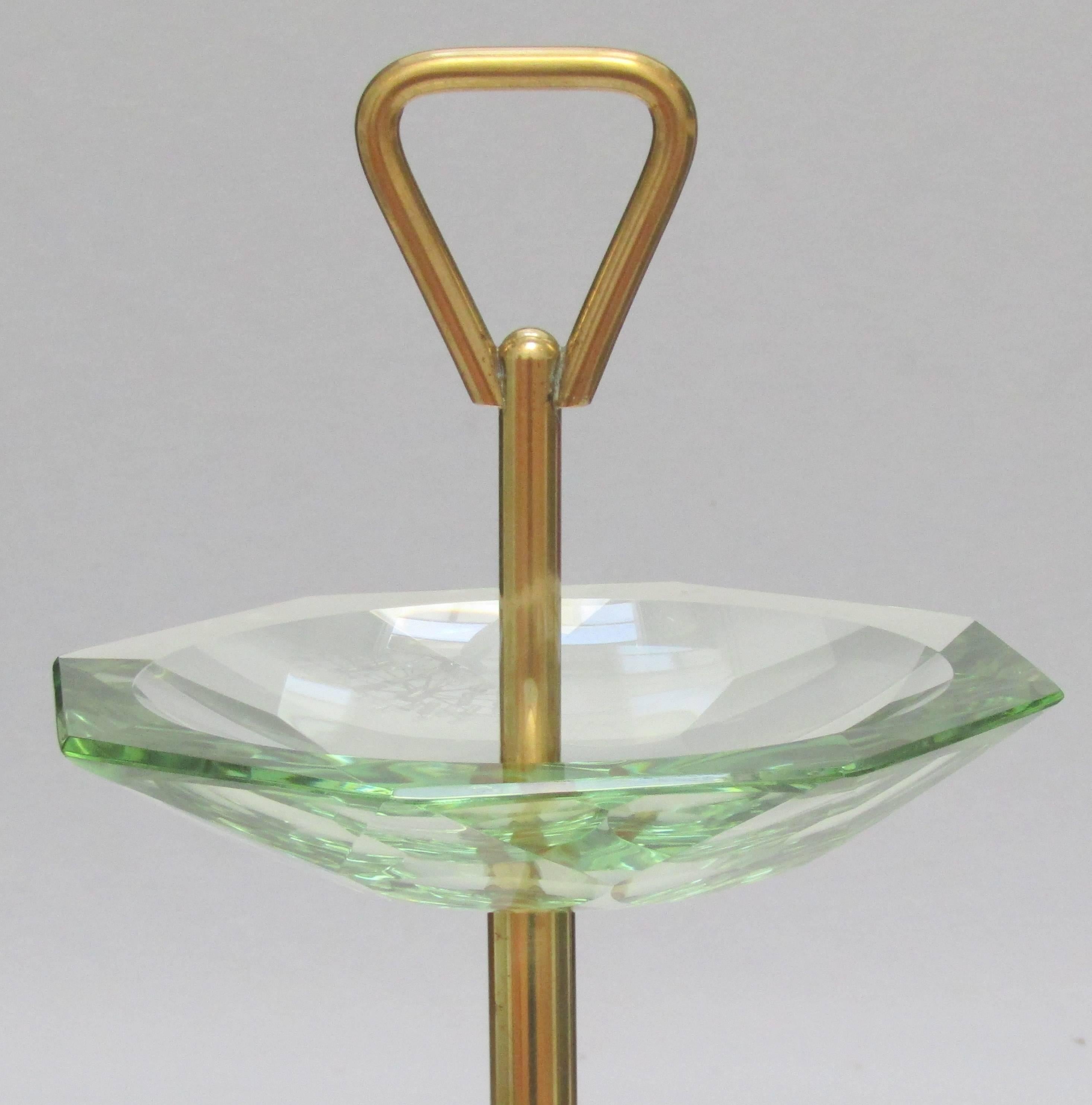 A brass and crystal ashtray
stand attributed to Fontana Arte.