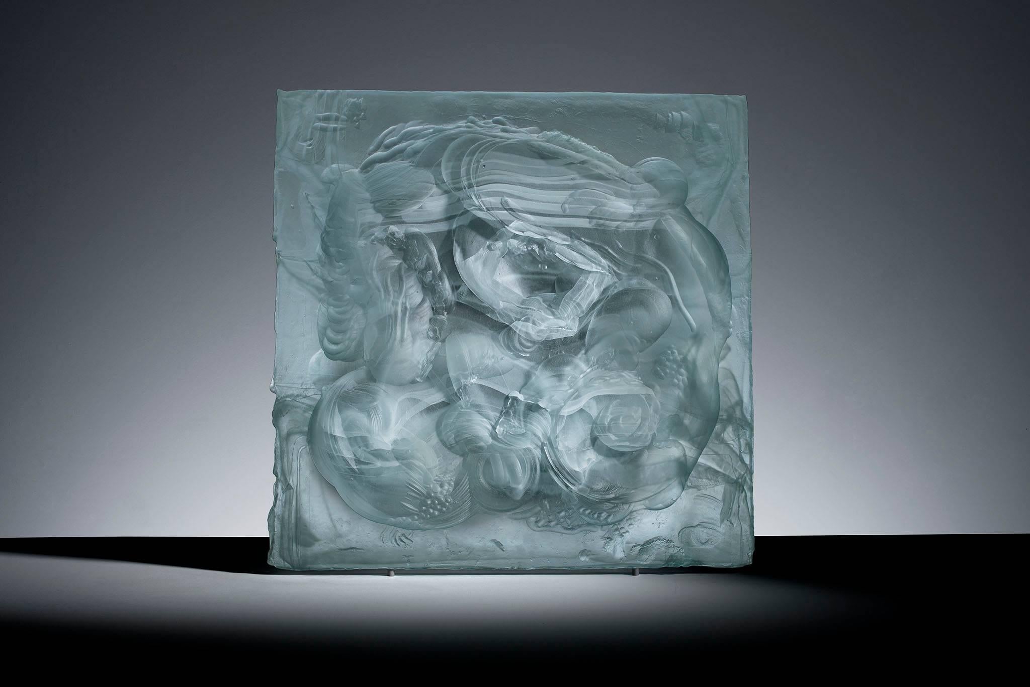 Carved Cast 1 unique cast glass relief sculpture

This relief cast artwork is formed by melting low iron glass into a hand drawn plaster mould. Danny Lane has been developing this technique over the past couple of years. The glass is transformed