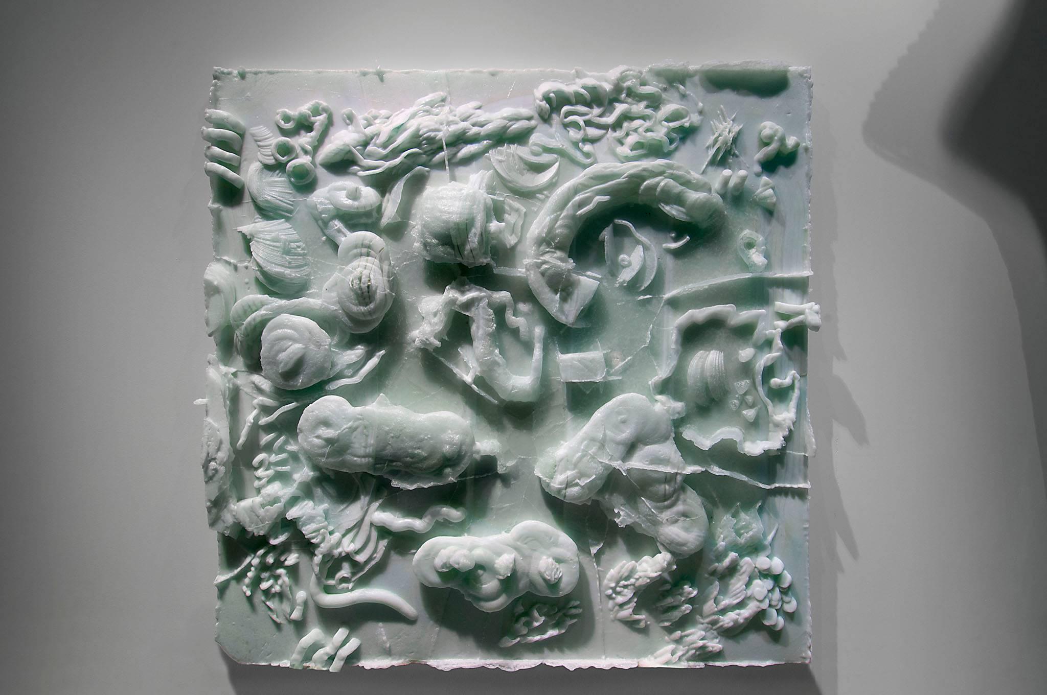Carved Cast 3 is a unique cast glass relief sculpture by Danny Lane

A three-dimensional drawing by Danny Lane with deep undercuts of archaeological forms found at the bottom of the sea. This cast glass has a jade like quality as the vitreous