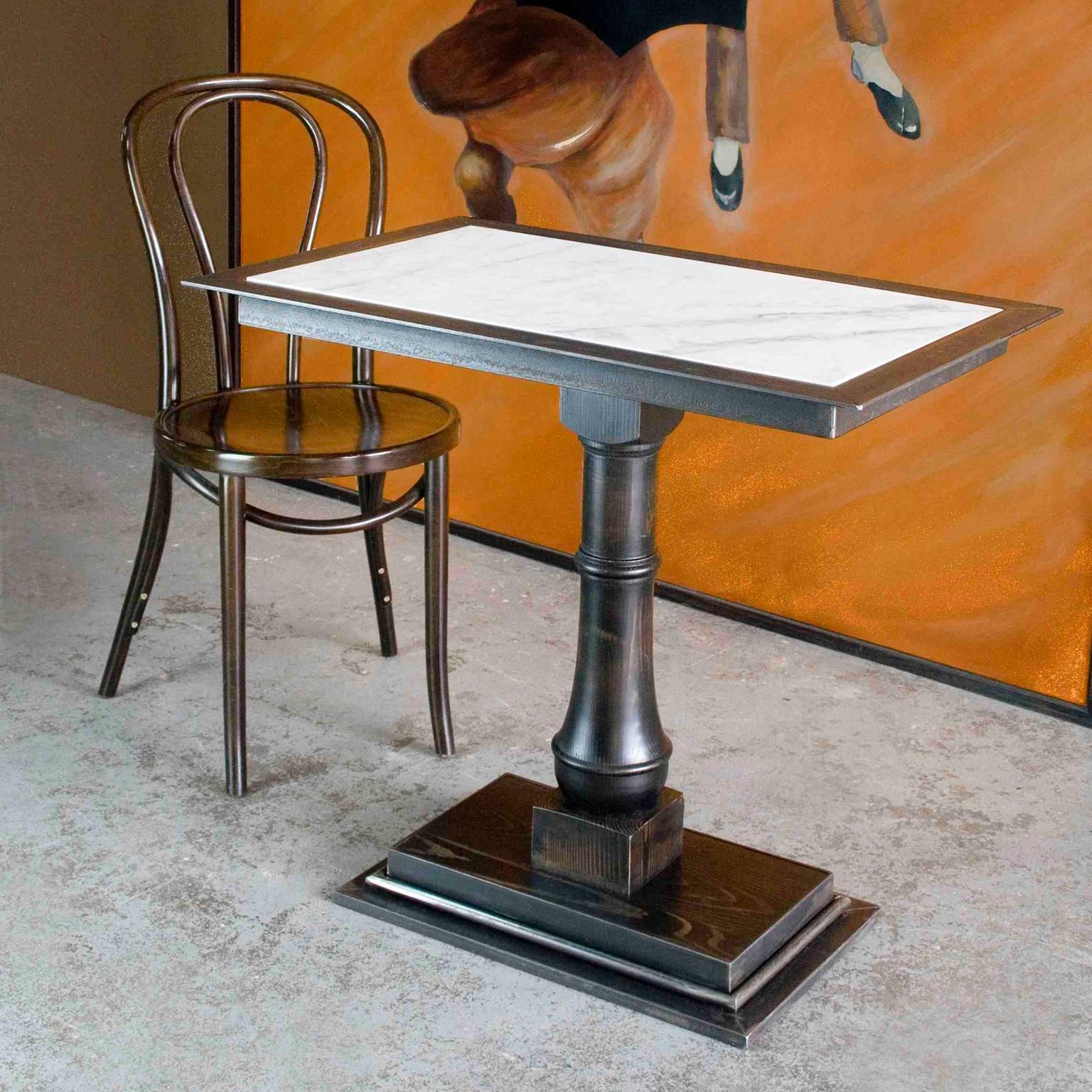 The balance between marble, mild steel and stained, aged finish timber base makes this original table a piece destined to brings back the magic of 19th-century French era. The bistro table adapts beautifully to our modern world and adds grace to any