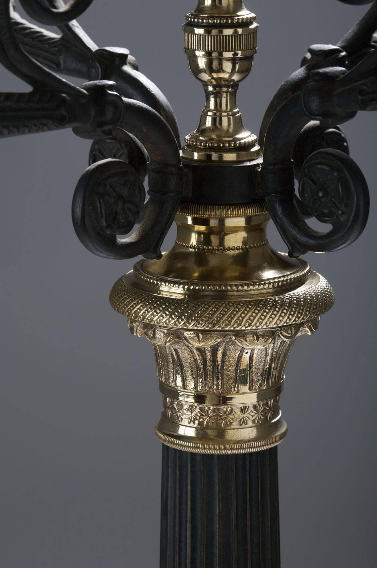 French, pair of gilt brass candelabra on a fluted column with five lights, all having their original bobeches 25.25″ H, 6.0″ triangular base circa 1880.