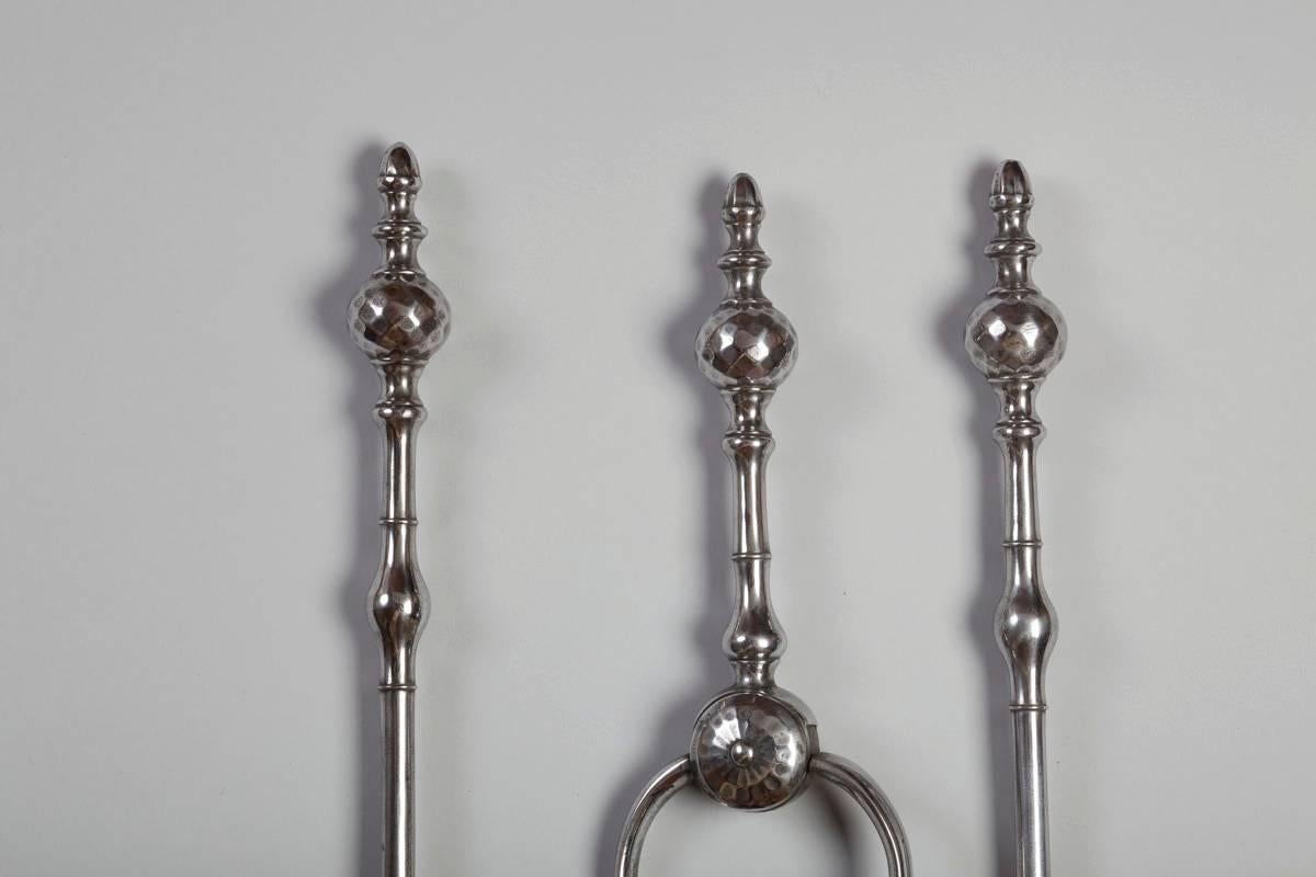 English, steel set of three fire tools with facetted ball tops, with beautifully formed acorn finials, and flared shovel with acanthus leaf central design 31.0″ long, 1780 period Georgian.