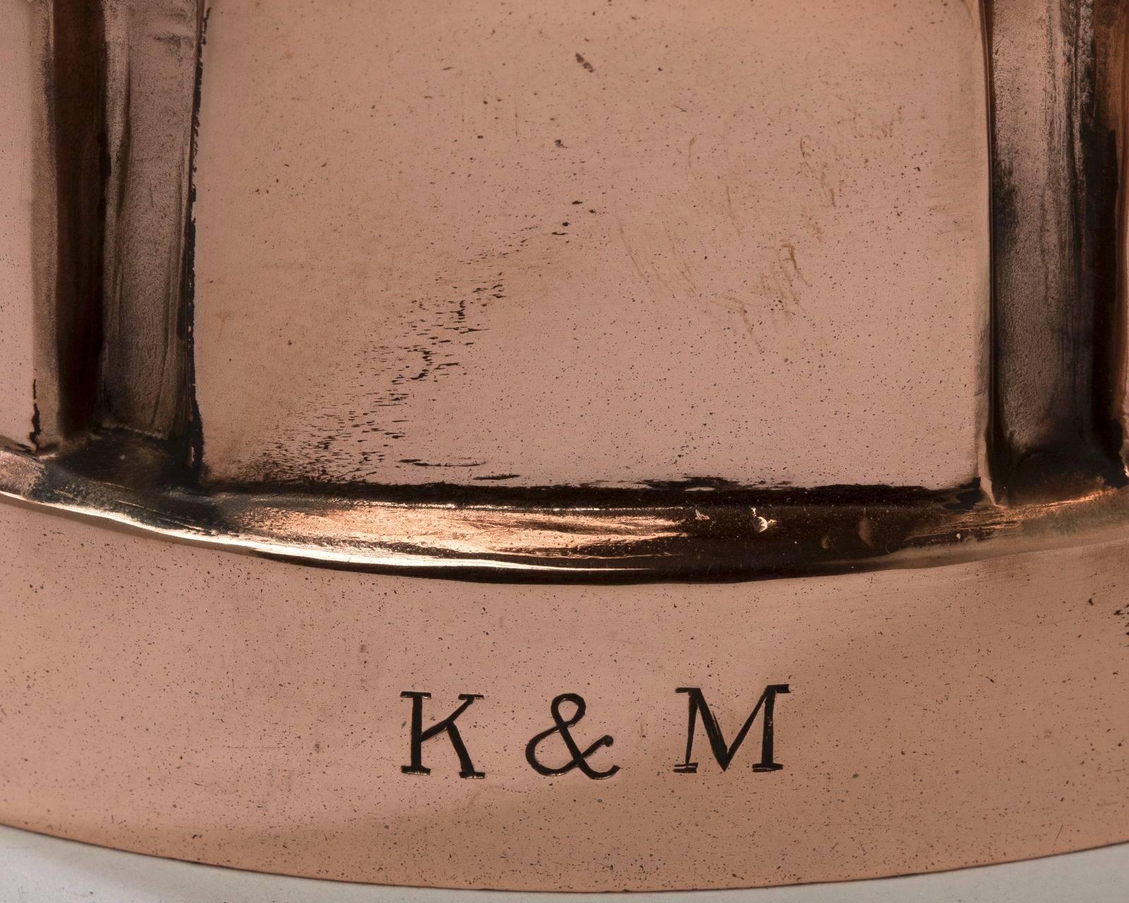 English, copper round mould with a Greek Key pattern on the top stamped RTB K& M, 
