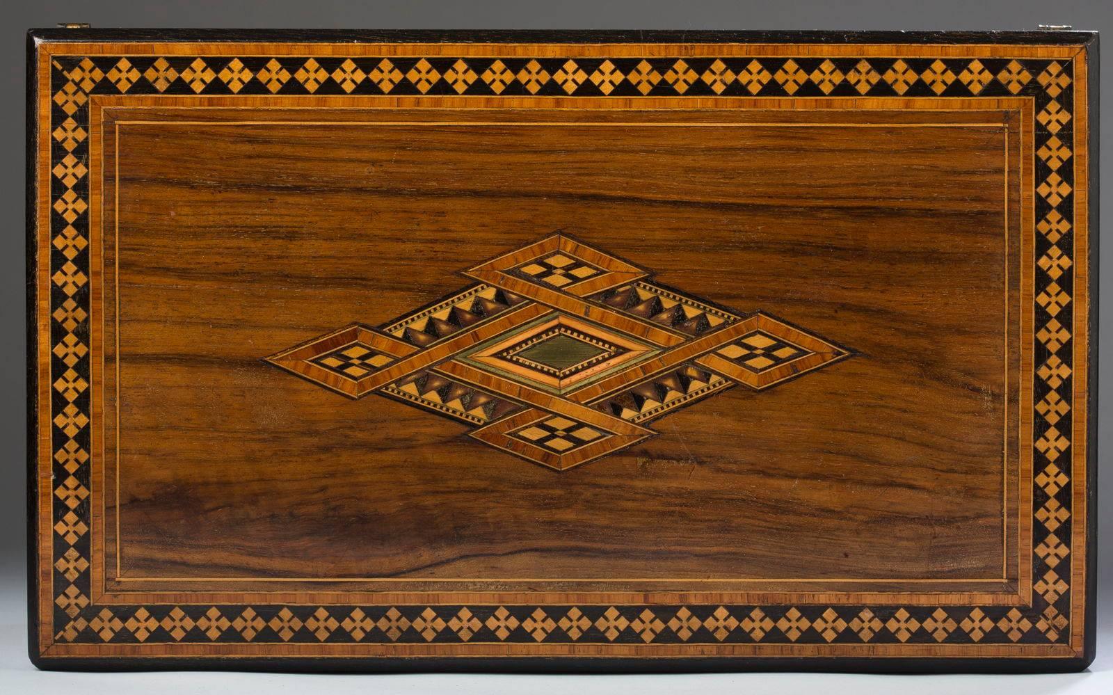 English, writing slope crossbanded and inlaid with satinwood, ebony, and other exotic woods fitted with original inks. Measures: 16.0″ L, 9.75″ W, 6.75″ H, circa 1850.