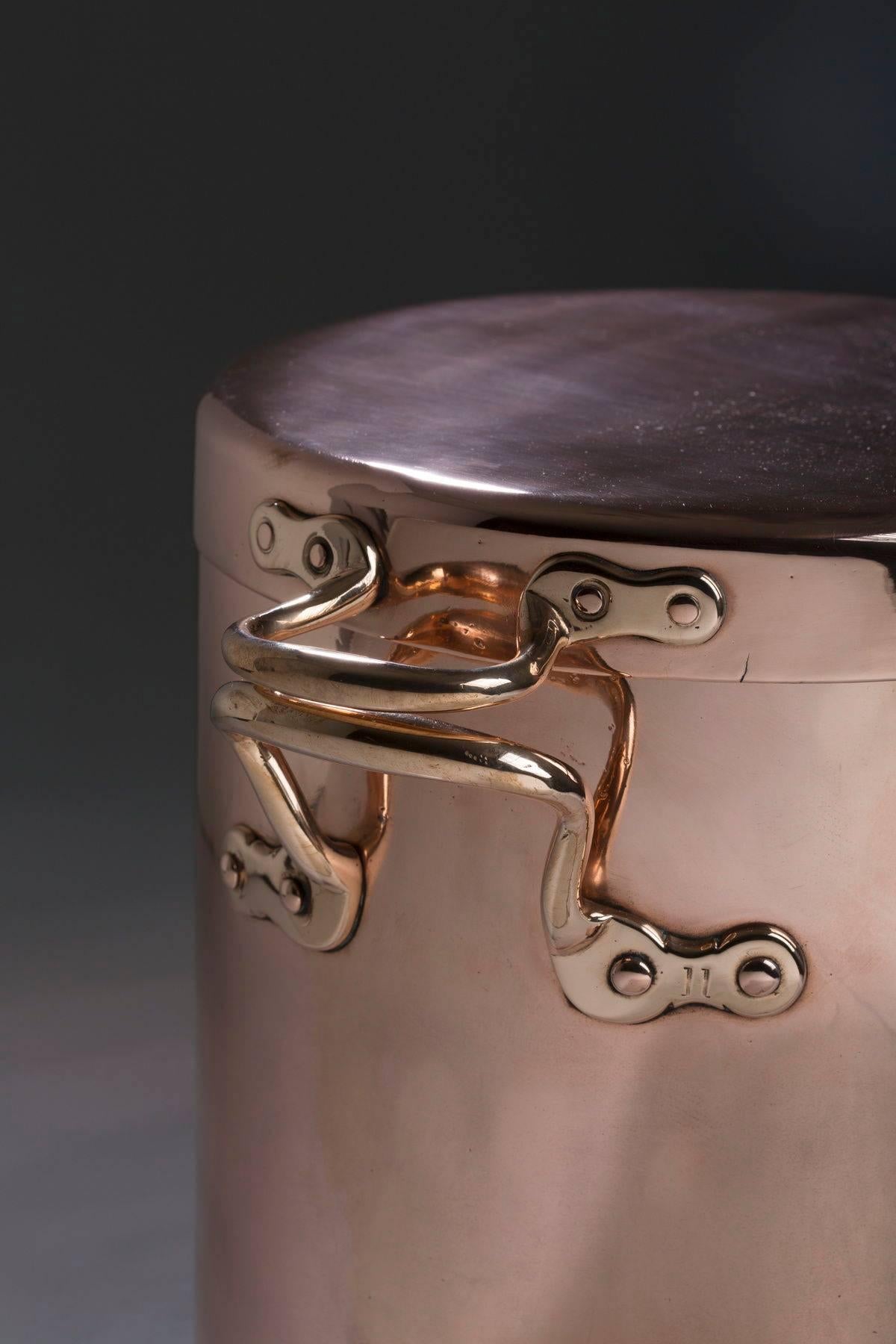 English, copper stock pot with lid handles marked ’11’, 11.5″ diameter, 11.0″ high, circa 1880 dovetailed construction.