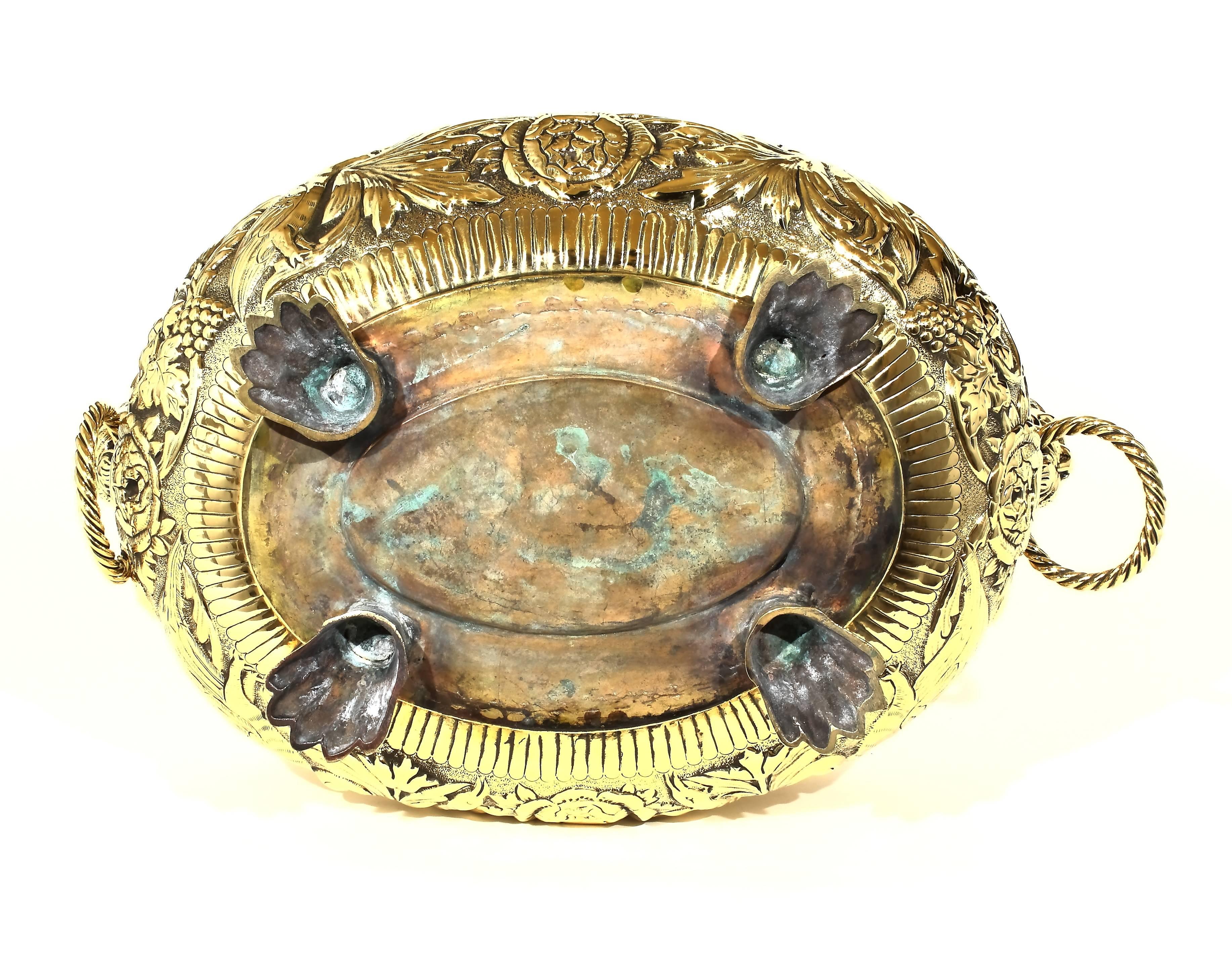 French, oval brass planter with cast lion’s head handles and cast feet. Heavy quality. Slightly different pattern to both sides.

Top rim 17” x 12.75”. Overall height 8.50”.

France, circa 1860.