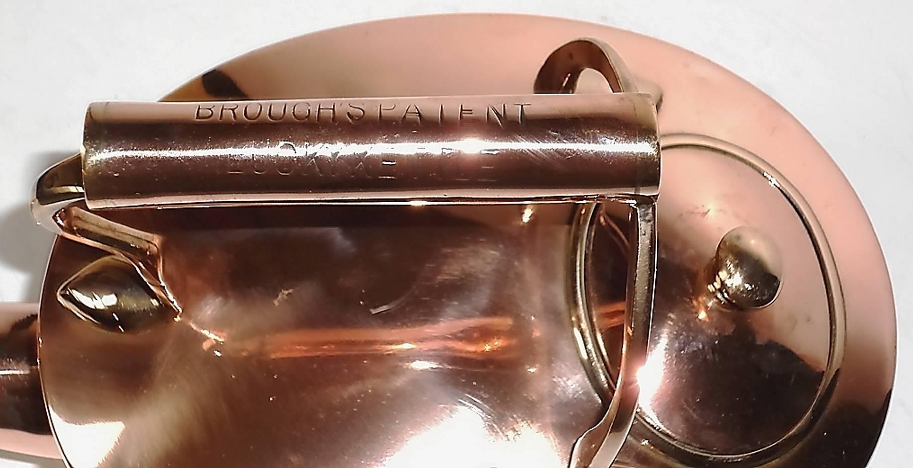 Oval copper kettle. Dovetail seam to spout end of body. Dark underneath. Back of body slightly pitted.

Handle stamped:- BROUGHS PATENT LUCKY KETTLE.

England, circa 1870.