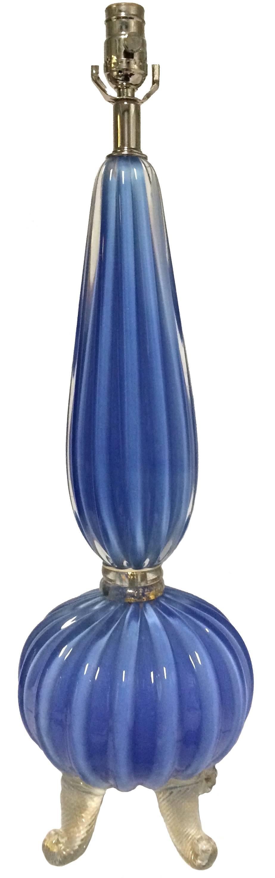 Midcentury Murano single blue glass table lamp attributed to Barovier & Toso. Rare cornflower blue opalescent ribbed glass. Curvy gold flecked dolphin-footed base. Newly rewired, takes one standard bulb.
