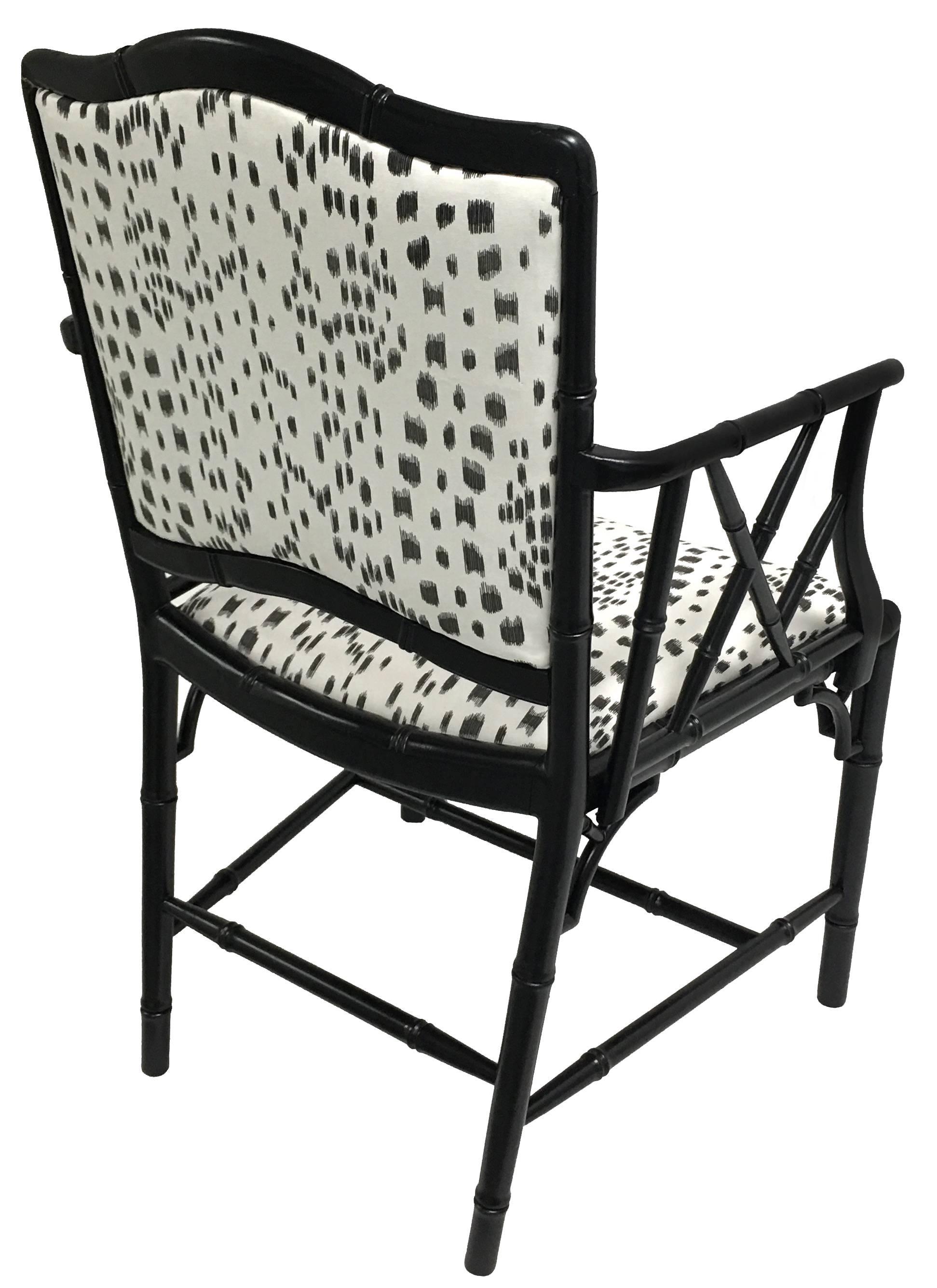 1960s black faux bamboo armchair. Newly refinished in black satin painted finish. Newly upholstered in Les Touches by Brunschwig Fils in black/white. Arm is 28.25