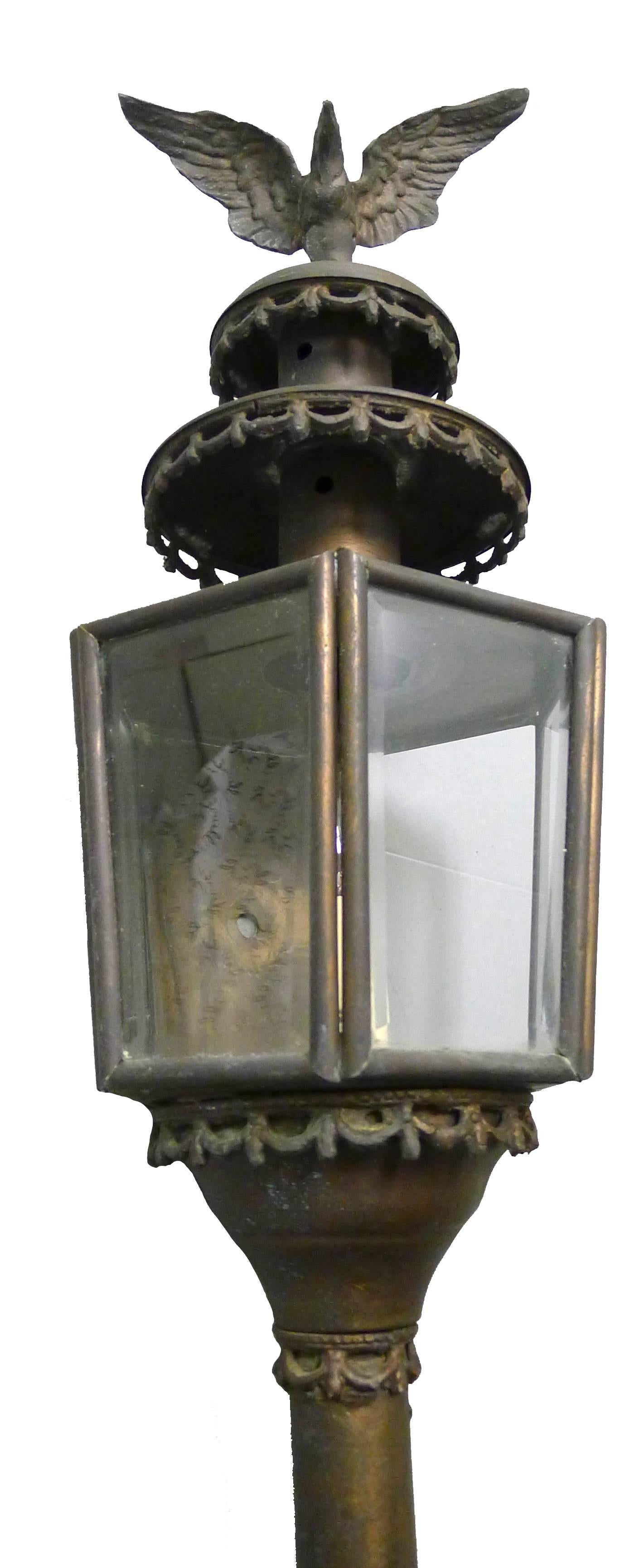 Pair of 1880s American brass Federal style eagle motif coach lanterns. Newly rewired. Each light takes one candelabra bulb. Most recently used as wall sconces on a porch. From a Greenwich, Ct waterfront estate.