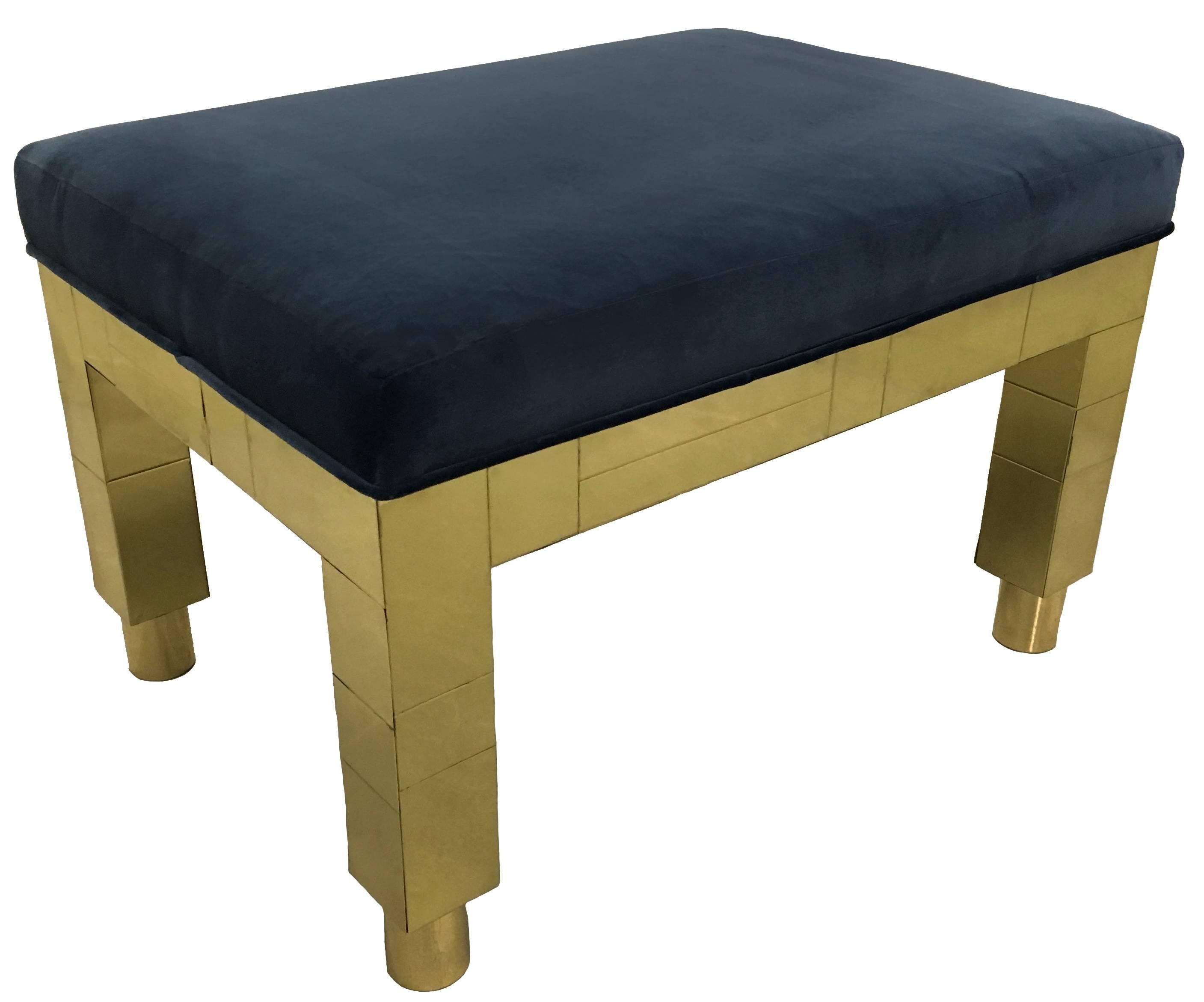 Pair of Paul Evans for Directional Furniture Cityscape benches. Polished brass patchwork design. Newly upholstered in navy velvet. Benches retain original Paul Evans labels, circa 1977. 
Bottom cylindrical brass casters can be removed if desired. 