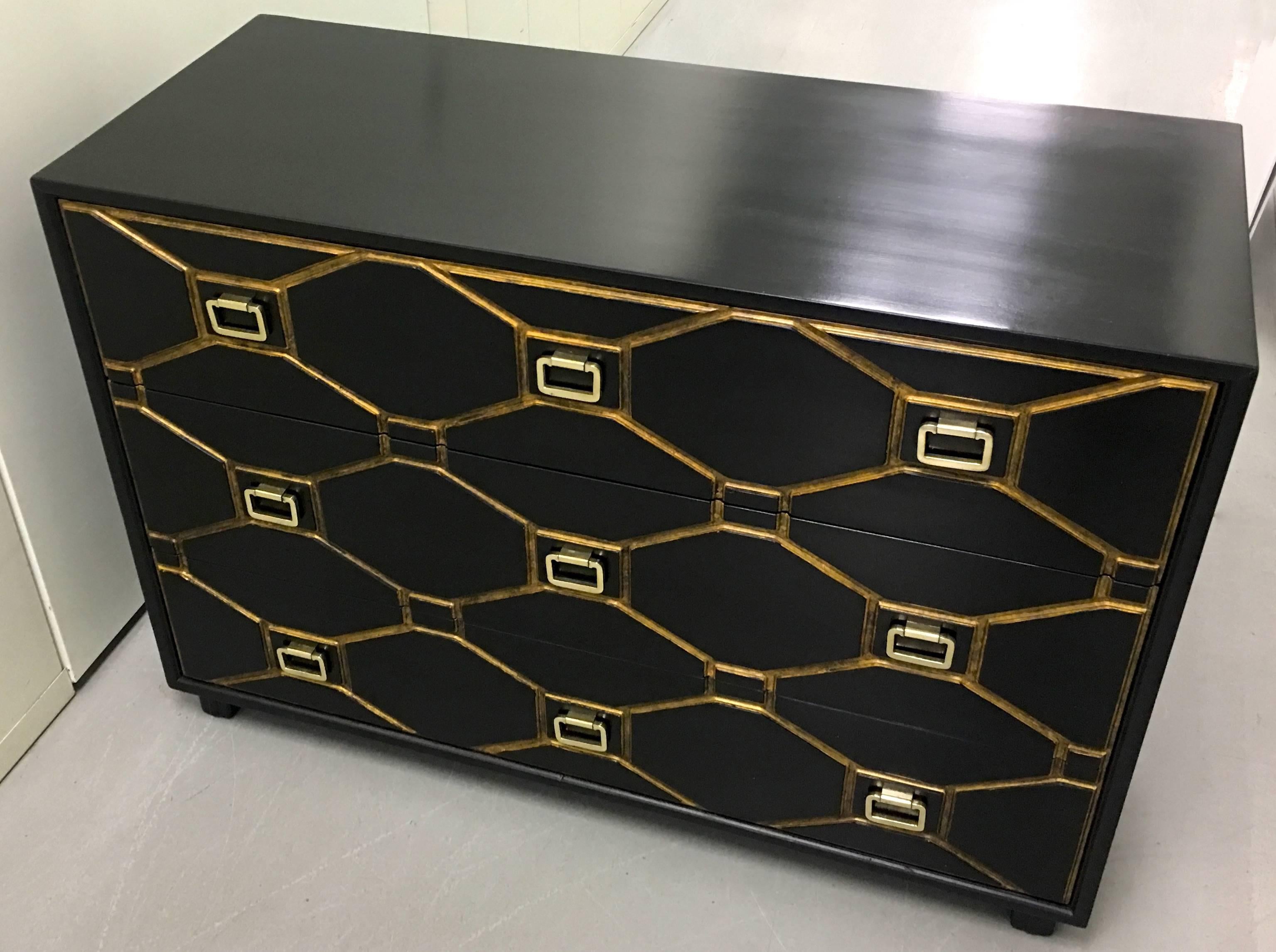 Dorothy Draper Viennese collection chest of drawers. Designed by Draper for Henredon. Three-drawer design with nine square brass pulls. Original black satin painted finish with burnished gold trim. Brass pulls are newly polished. The piece is