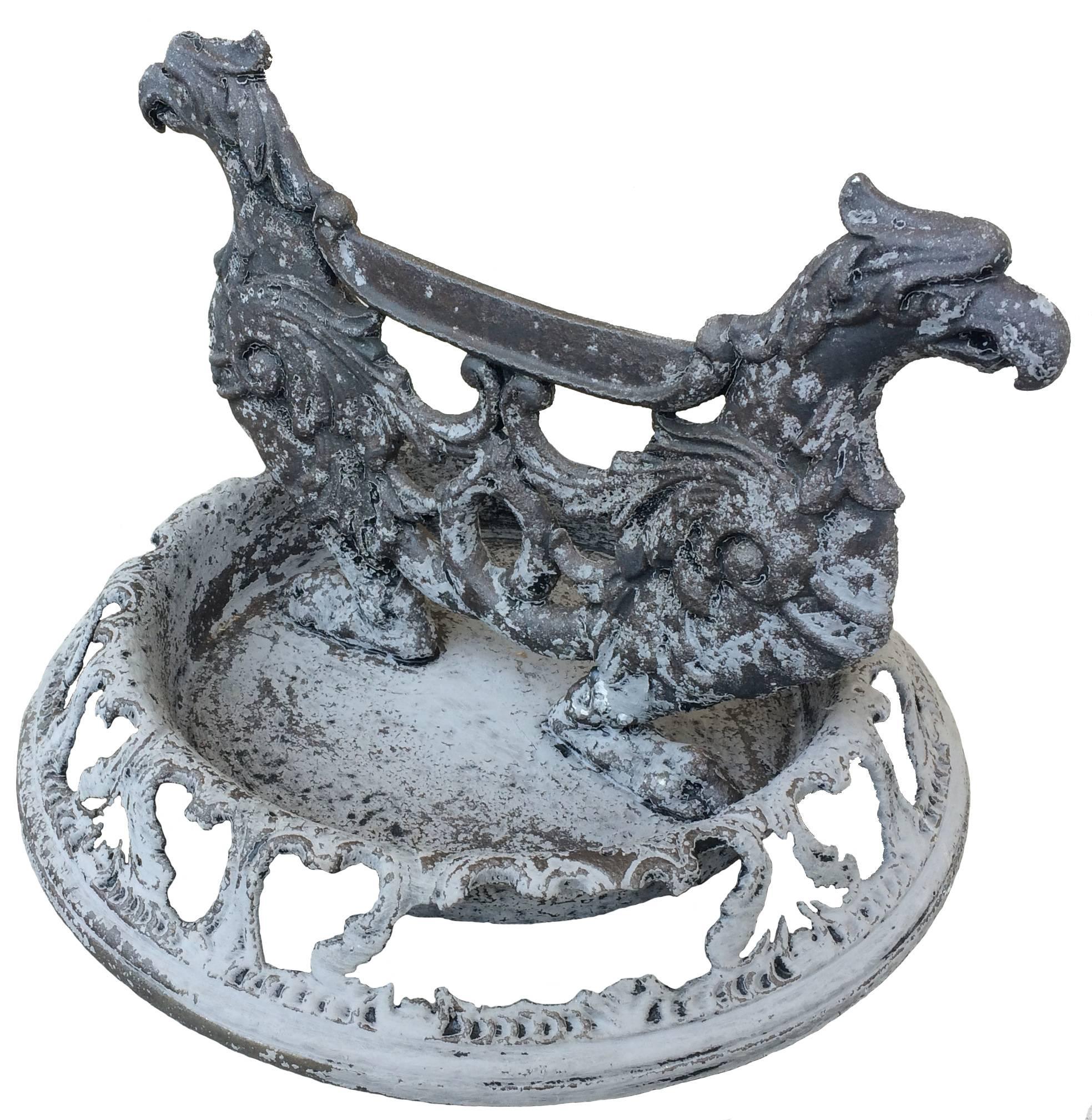 Antique cast iron griffon-motif boot scraper. Wrought iron construction. Has been stripped down to the unfinished metal. From a Greenwich, Connecticut estate, circa 1880s.
 
