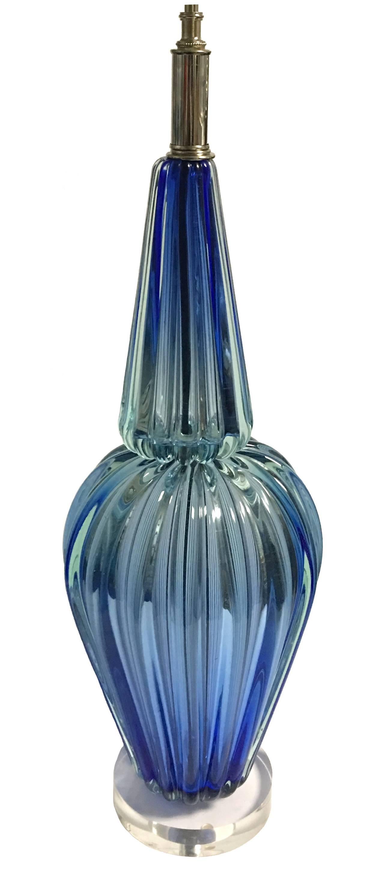 Mid-Century Murano blue glass lamp by Archimede Seguso. Newly rewired with new Lucite base. Takes two candelabra bulbs. Lampshade not included.
 