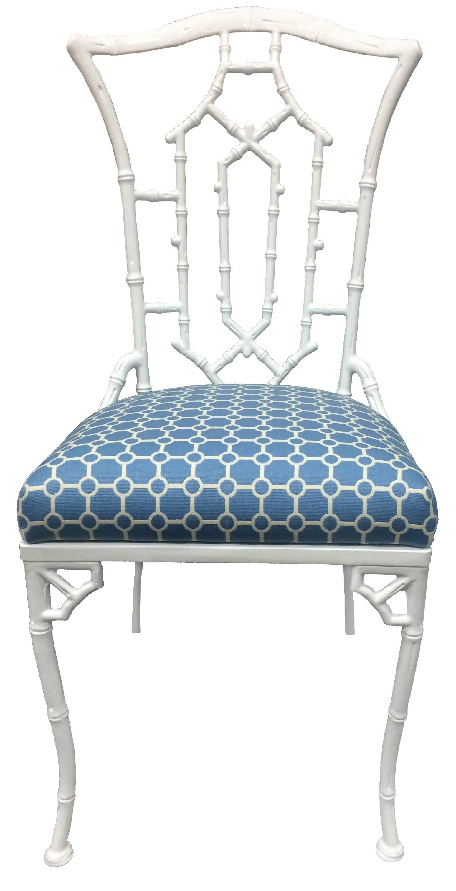 Pair of metal chinoiserie pagoda side chairs. Newly powder-coated in a white gloss finish. Newly upholstered in Clarence House 'Biarritz' blue geometric indoor or outdoor fabric. Suitable for indoor or outdoor use. 
Measures: Seat 18.5