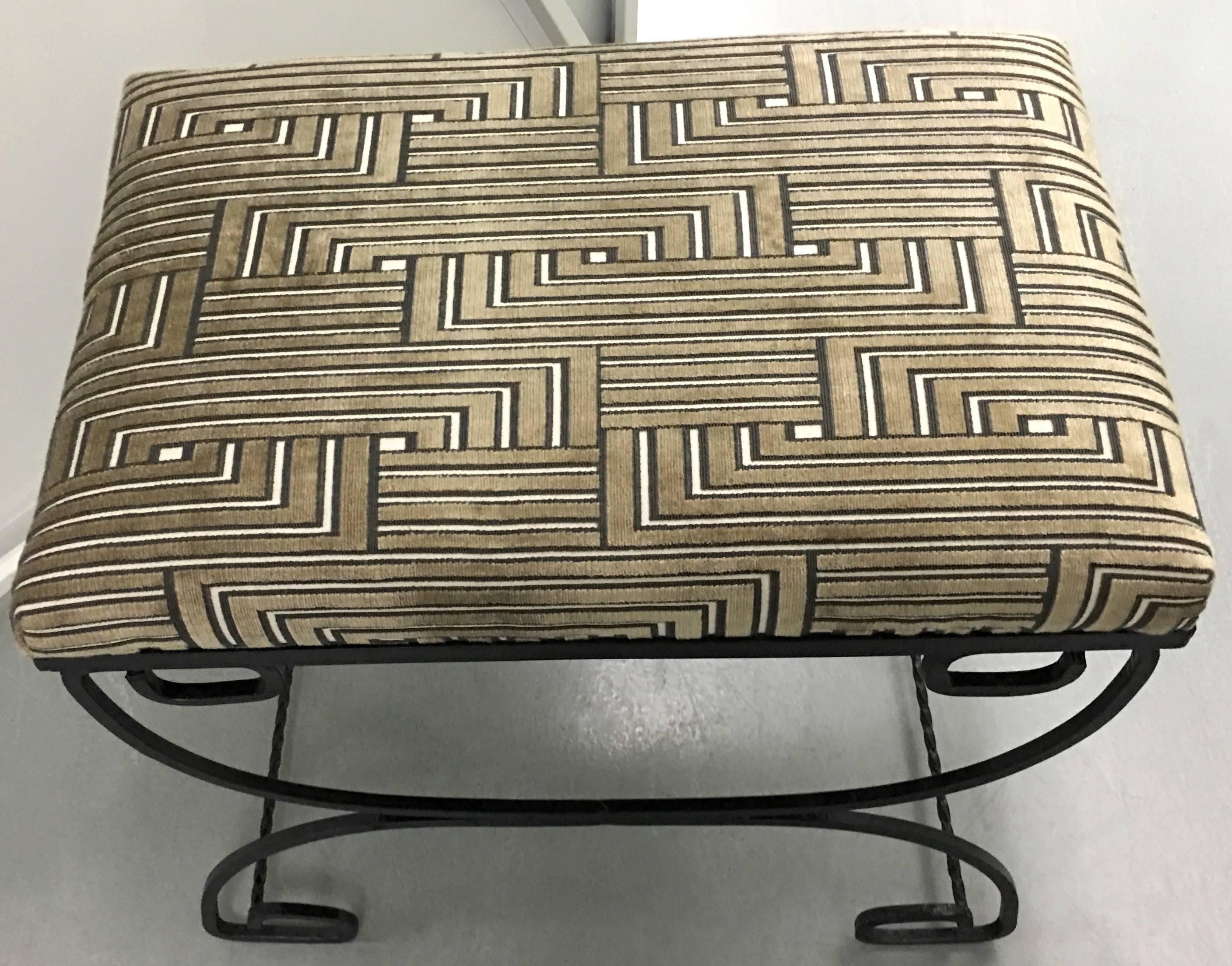 1950s Art Deco style bench. Black wrought iron with greek key detailing. Newly repainted in black satin finish. Newly upholstered in Lee Jofa Louvered Maze cut velvet.