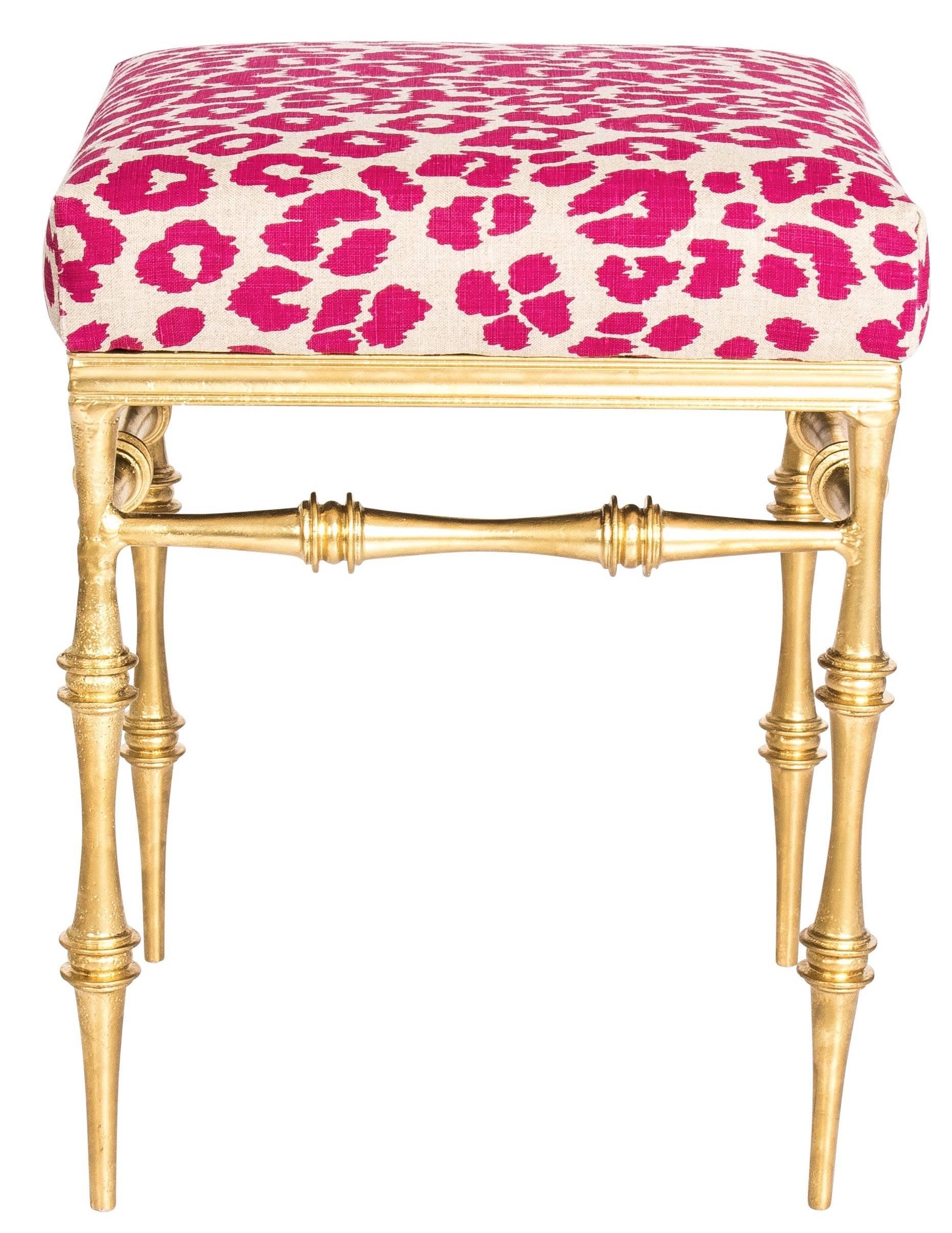 Pair of gold gilt metal benches. Newly upholstered in Schumacher 'Iconic Leopard' linen fabric in fuschia pink/ natural colorway.
 
