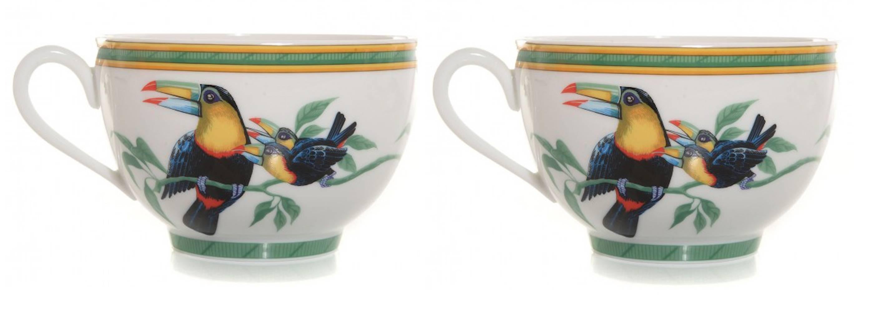 Pair of Hermès porcelain toucan cups and saucers. Saucer 7.25