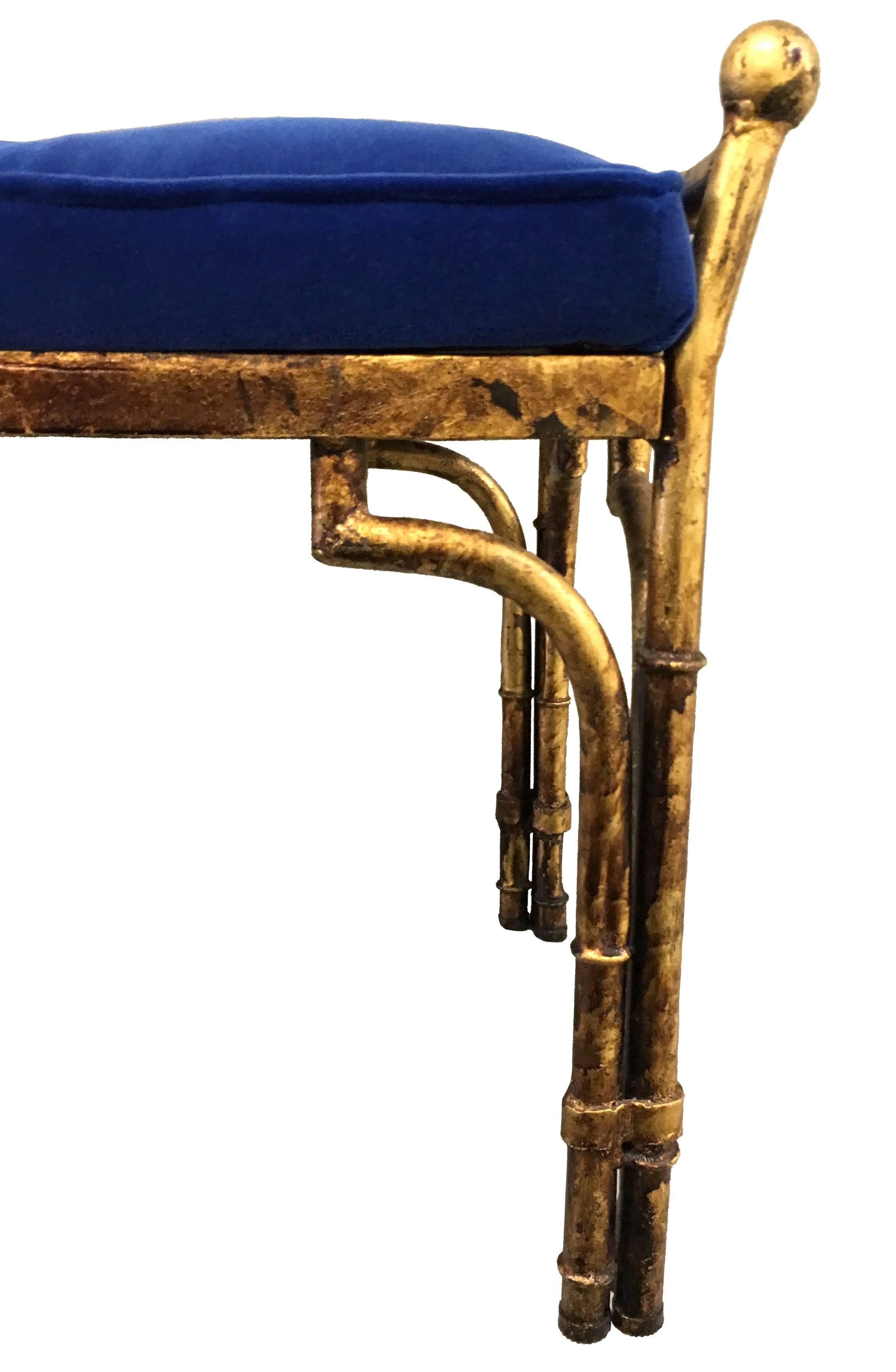 Gold gilt metal faux bamboo bench by Labarge. Newly upholstered in sapphire blue velvet fabric with tufted detailing.