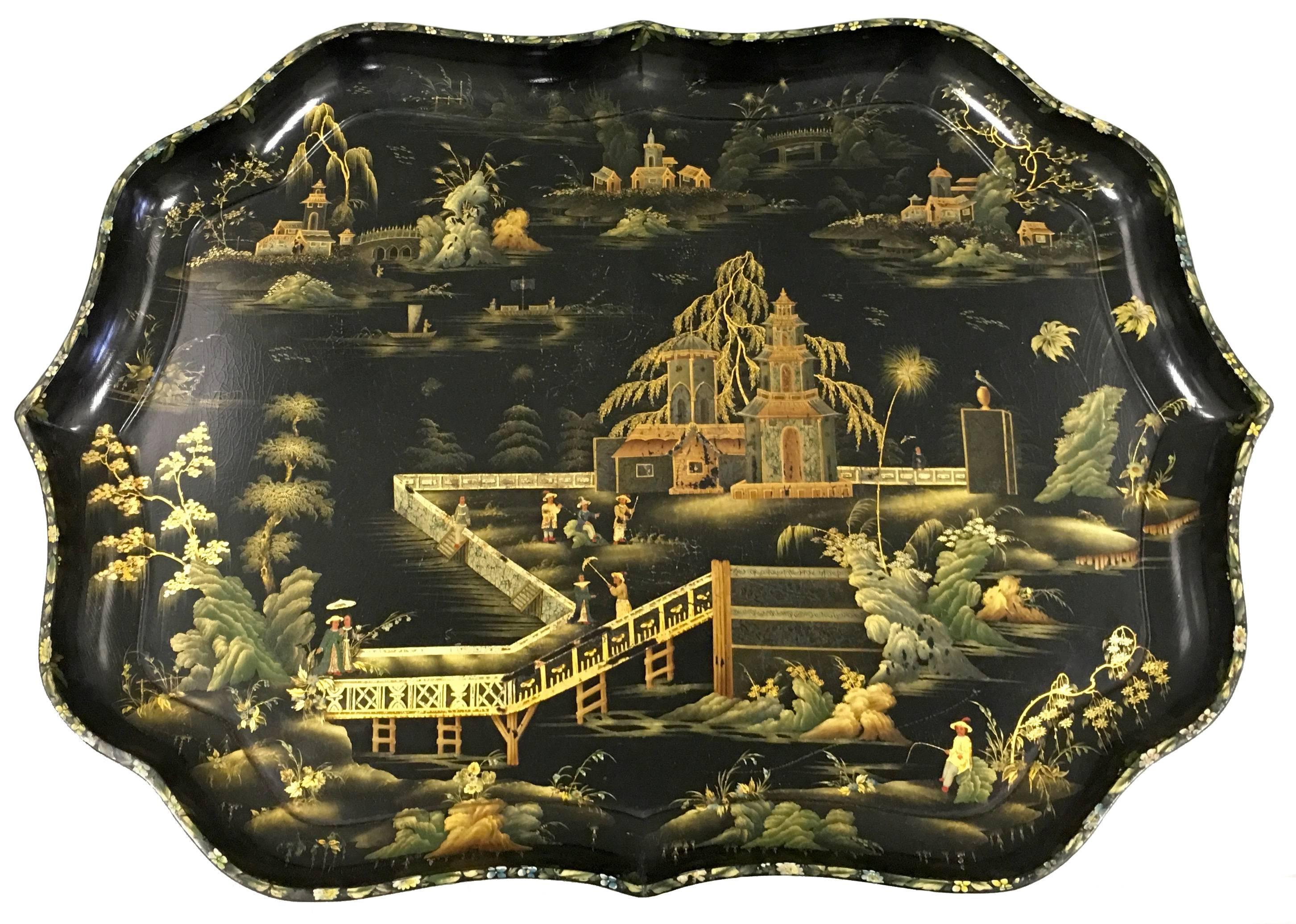 chinoiserie papier mâché tray by Henry Clay. Chinoiserie polychrome scene with gilt detailing. Tray is stamped Clay King St Cov't Garden (London.)
Custom stand of a later period in black lacquered wood.
