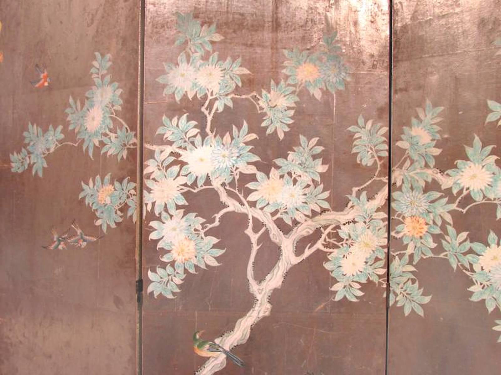 Early 20th century hand-painted Chinese wallpaper screen. Four-panel silver leaf background with hand-painted scene. Screen is backed in a silver fretwork pattern.
Dimensions: 72