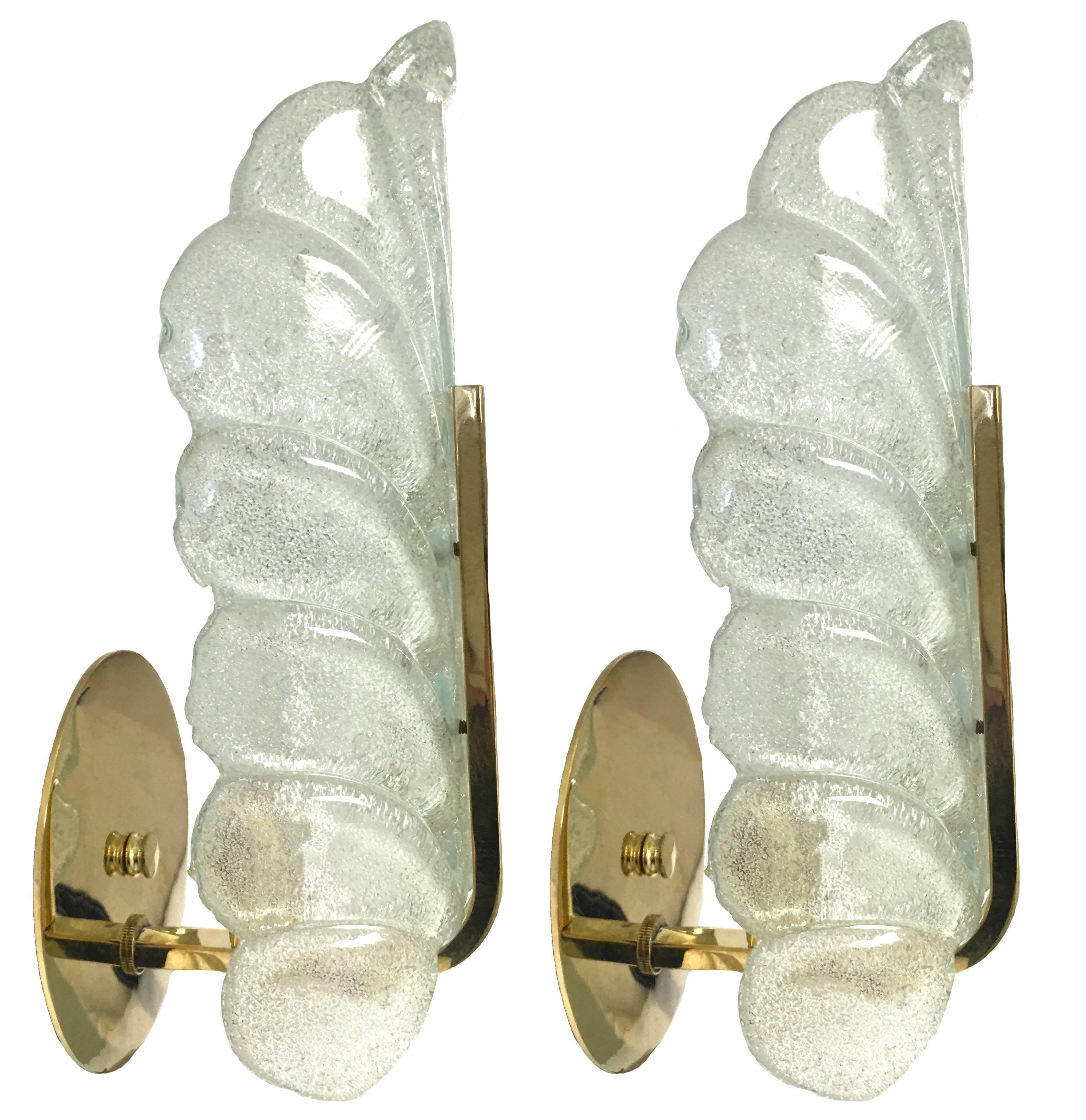 Pair of 1960s leaf sconces by Carl Fagerlund for Orrefors. Clear glass leaf with texturized sandblasted interior finish. Polished brass fittings and backplates. Backplate is 5