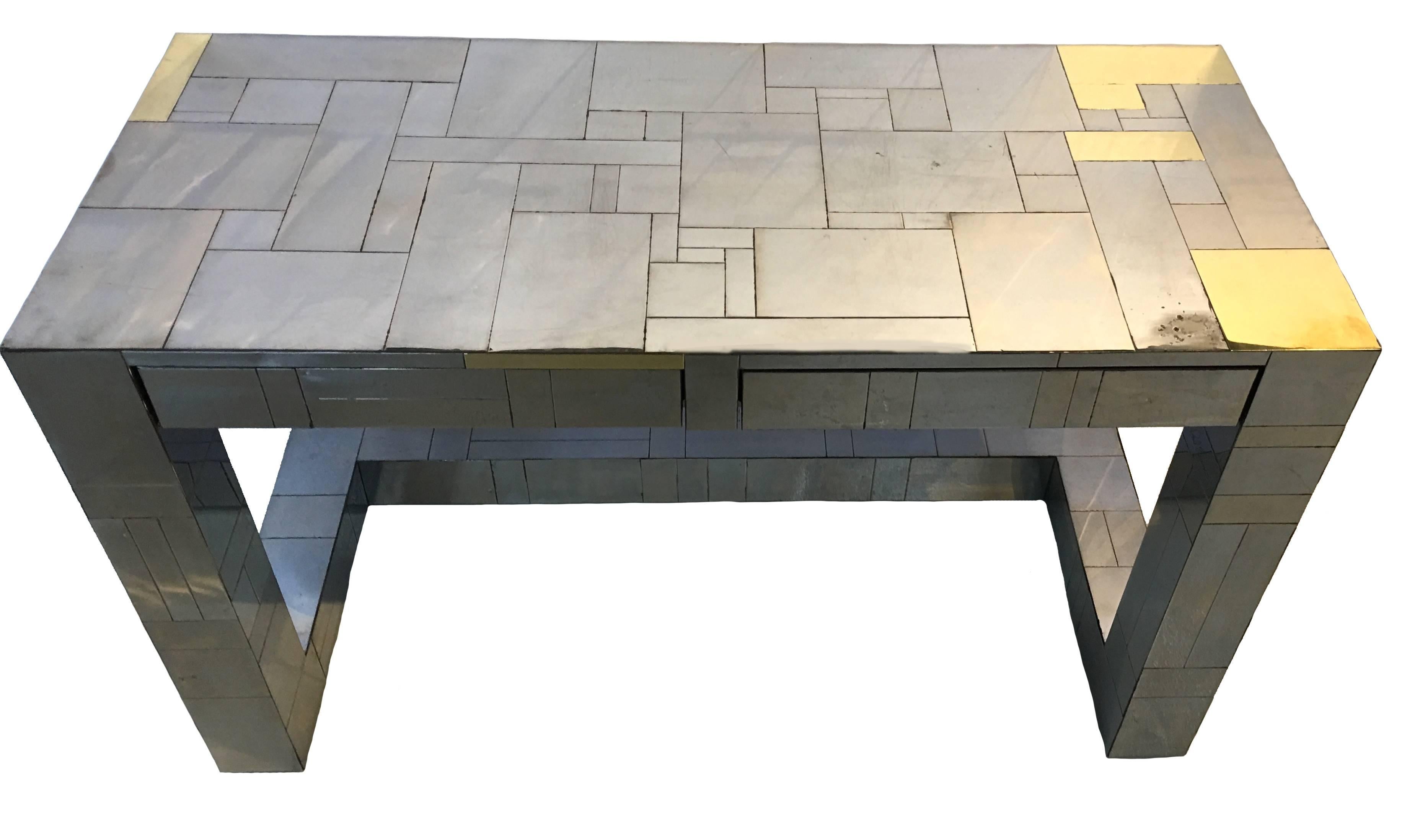 Paul Evans for Directional Furniture Cityscape desk. Polished chrome-plated steel and brass patchwork design. Two front drawers. Signed Paul Evans on lower right desk leg.