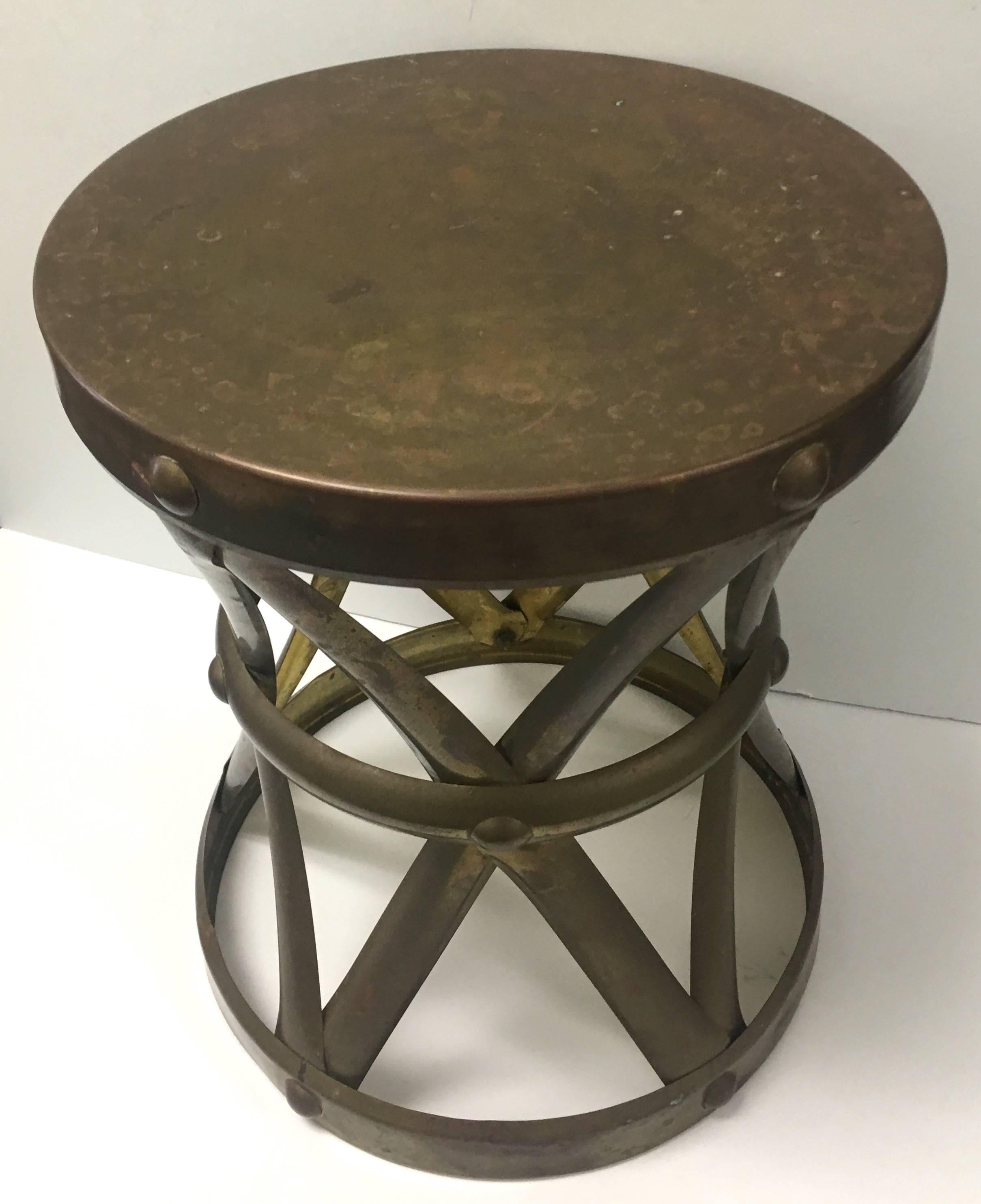 Brass X-base drum stool. Stamped 'Made in Hong Kong'. Overall unpolished as found patina.
