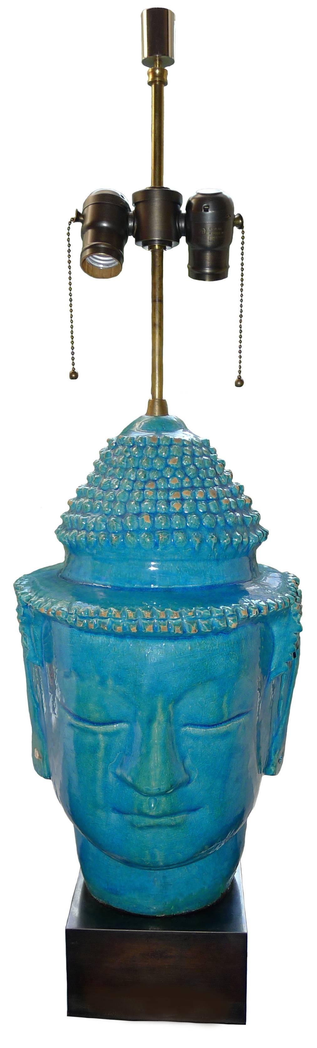 Large turquoise crackle-glazed terra cotta Buddha lamp. Newly refitted on a pewter metal base. Newly rewired. Takes two standard bulbs. Lampshade not included.
