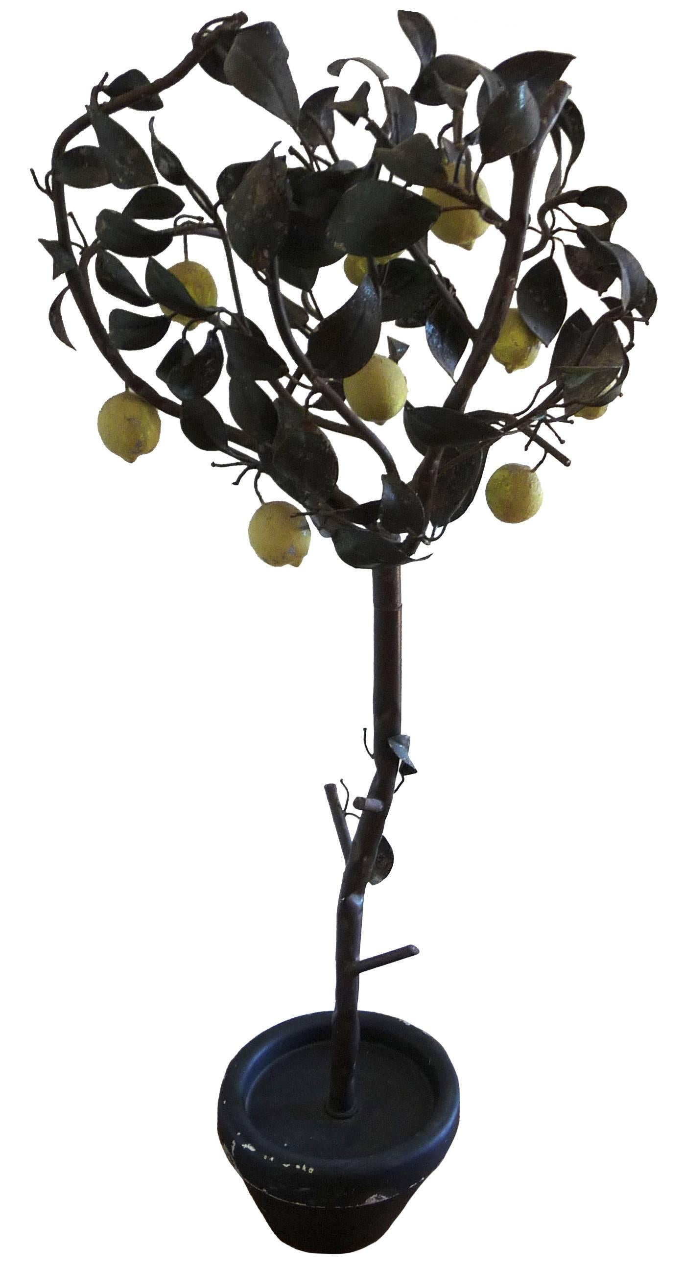 Pair of 1940s Italian painted tole lemon trees. Weighted painted black flower pot bases. Detachable into two sections for transport. Measures: Approx. 20" diameter across the widest part of the branches.