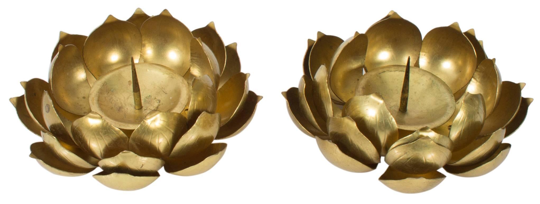 Set of three brass lotus flower candleholders. Solid brass with overall unpolished patina. Smaller flowers measure 5.5