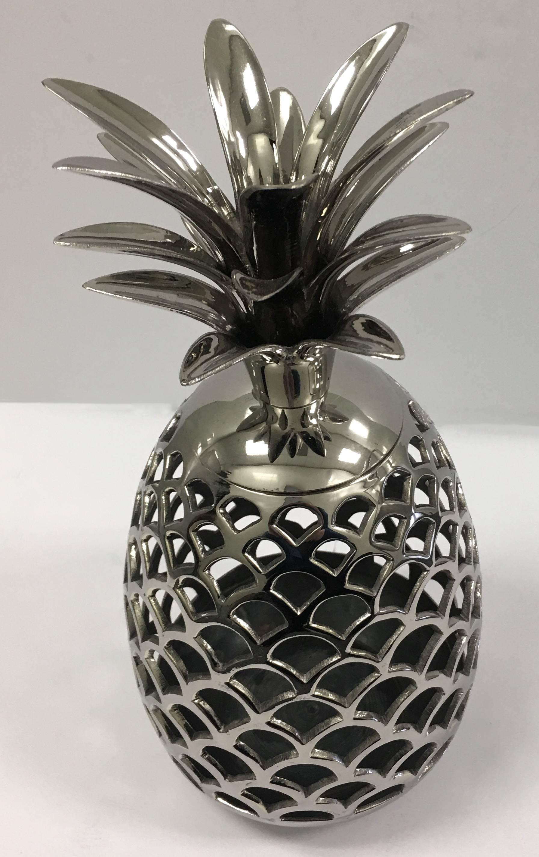Large pierced pineapple candle holder newly re-plated in polished nickel.