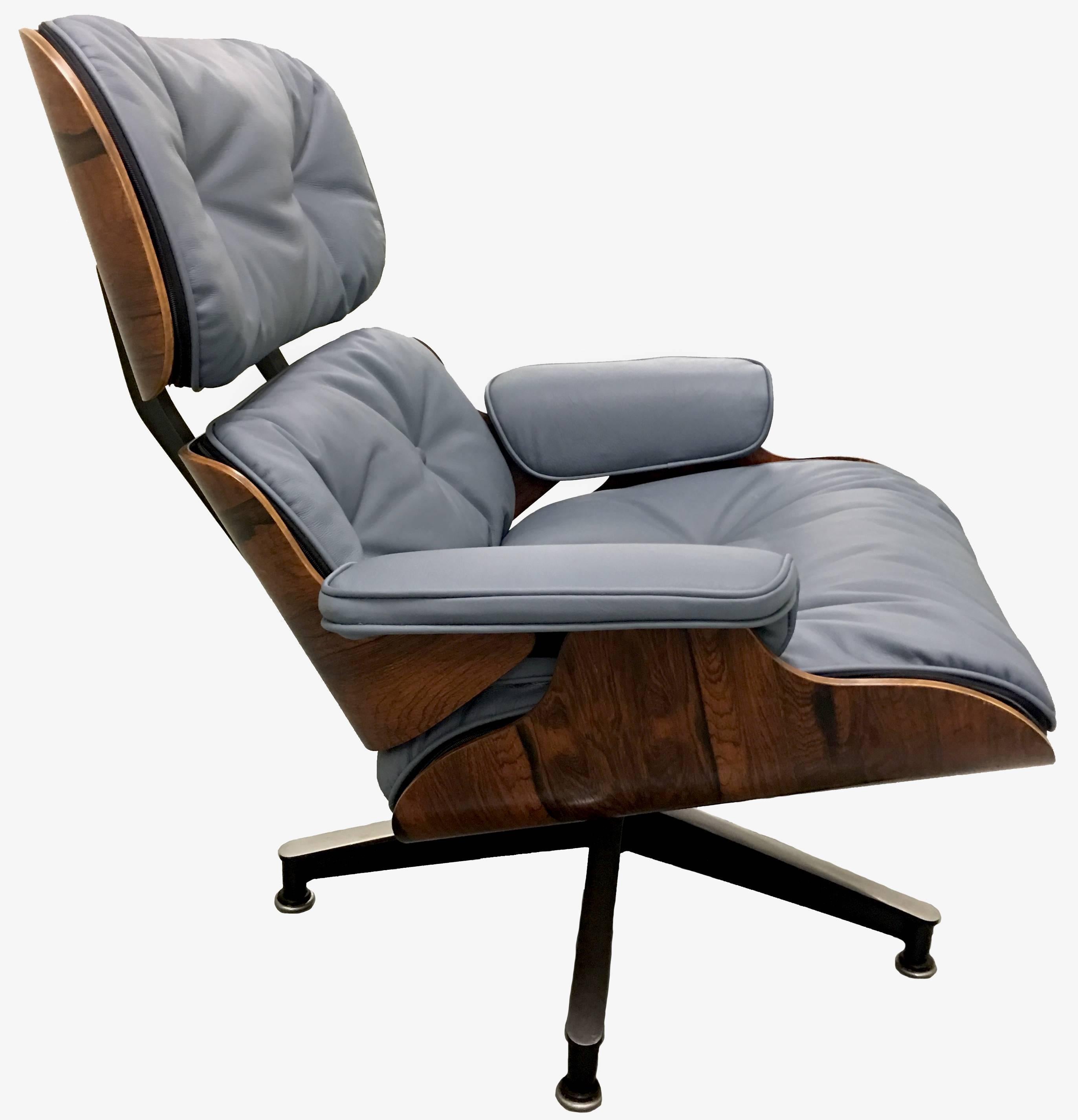1968 Eames for Herman Miller rosewood 670 lounge chair and 671 ottoman. Newly upholstered in royal hide 'Deep Space' (grey) by Edelman Leather. The set is in mint condition and the chair retains original labels. 

Measures: Chair 32