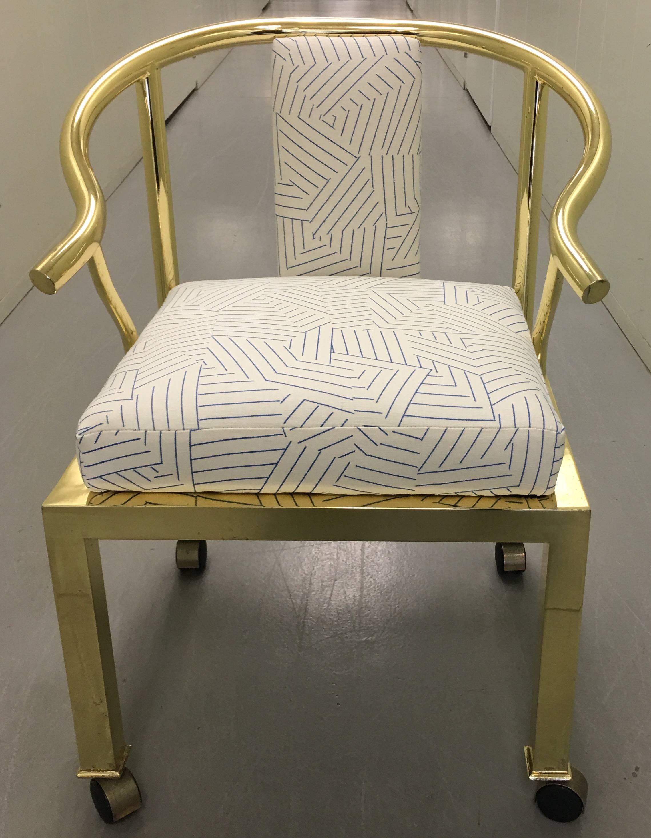 1970s polished brass horseshoe armchair by DIA- Design Institute of America. Newly upholstered in Miles Redd for Schumacher 'Deconstructed Stripe' in cobalt (blue or white) linen.