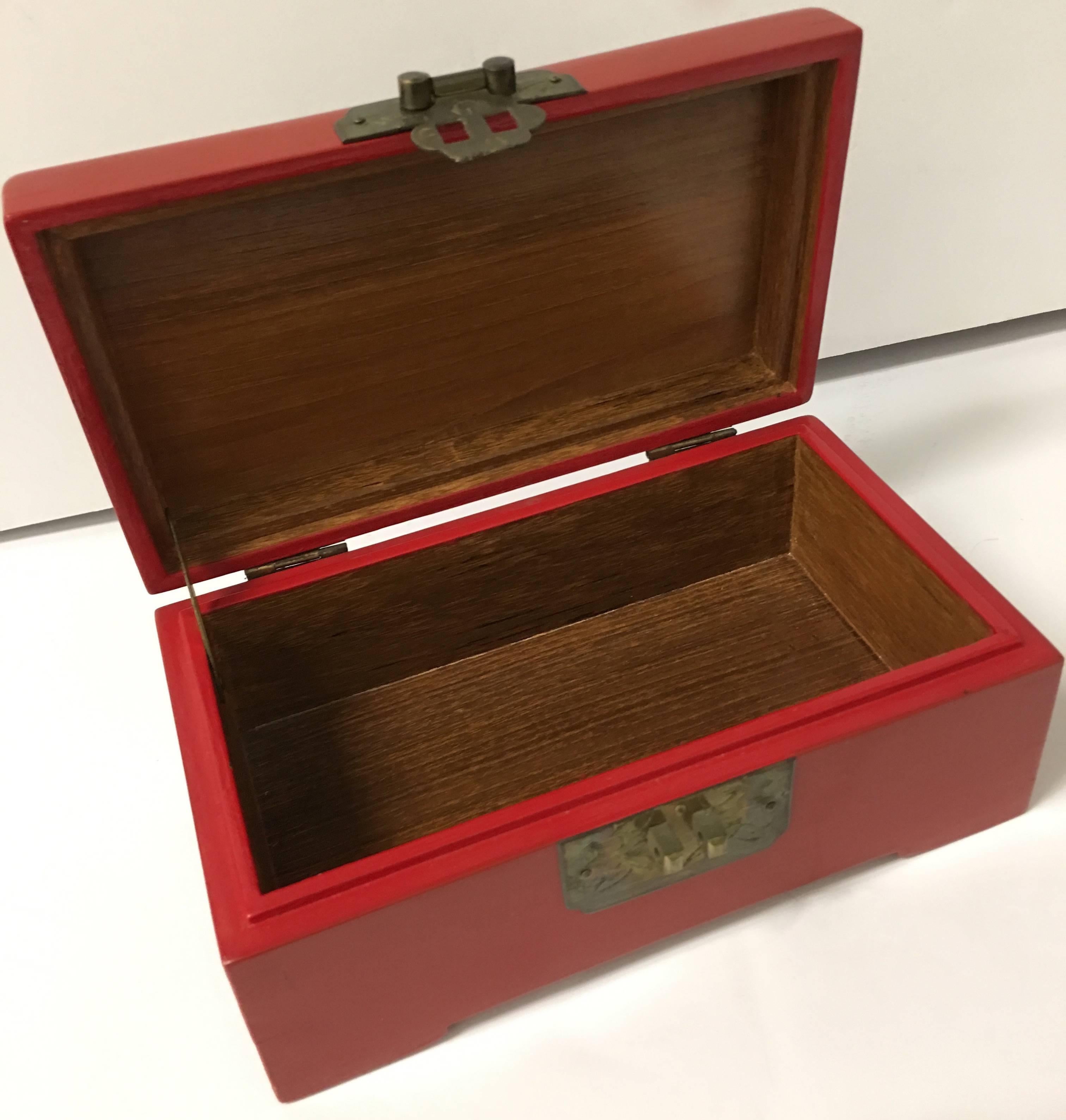 1960s Chinese cinnabar red lacquer box with brass accents. Removable brass lock with pin style key. No makers mark.