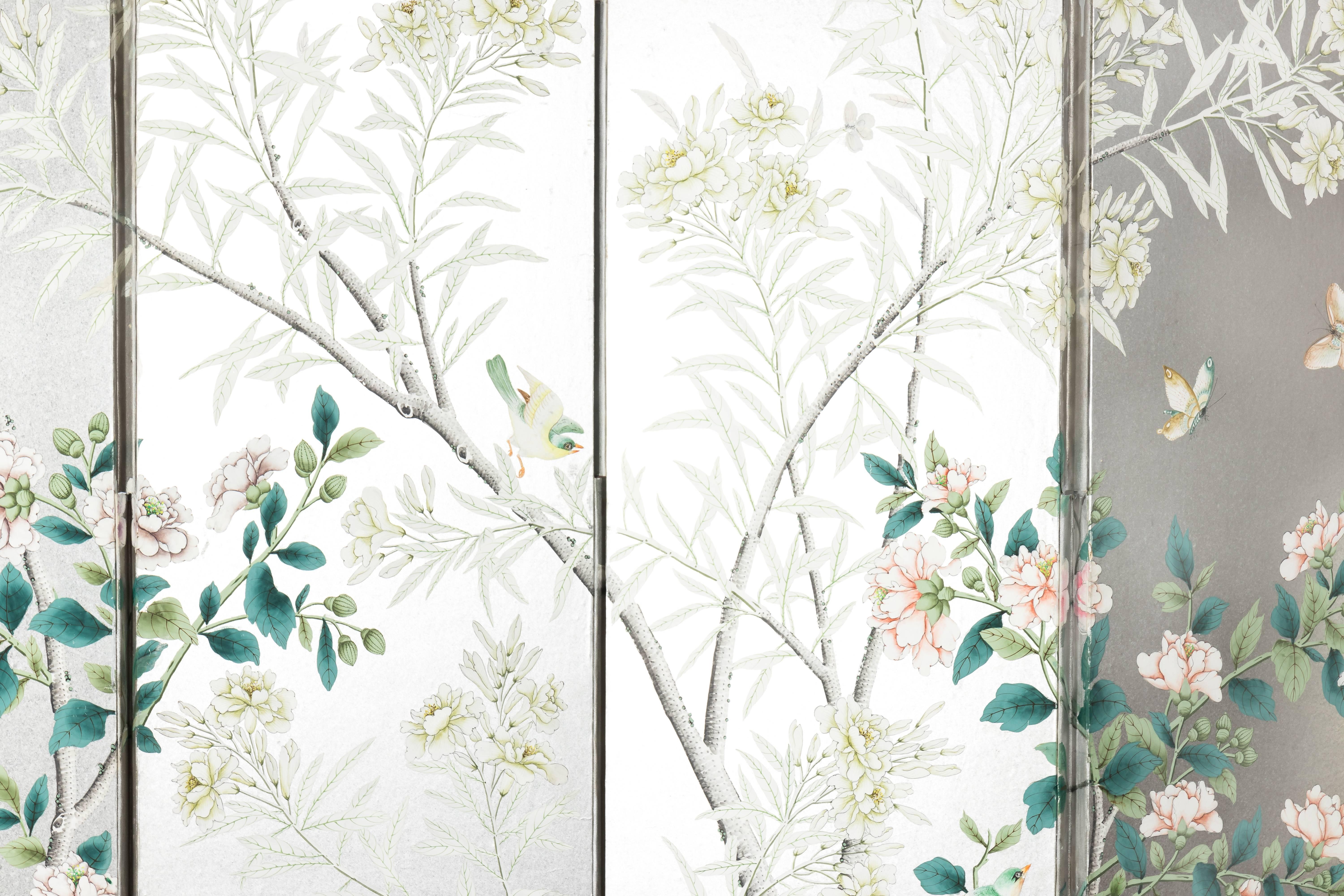 Silver four-panel Chinese screen by Gracie. All-over hand-painted floral design with bird and butterfly accents. Back of the screen is newly painted a pale gray. Screen is constructed of wood with paper and paint overlaid.