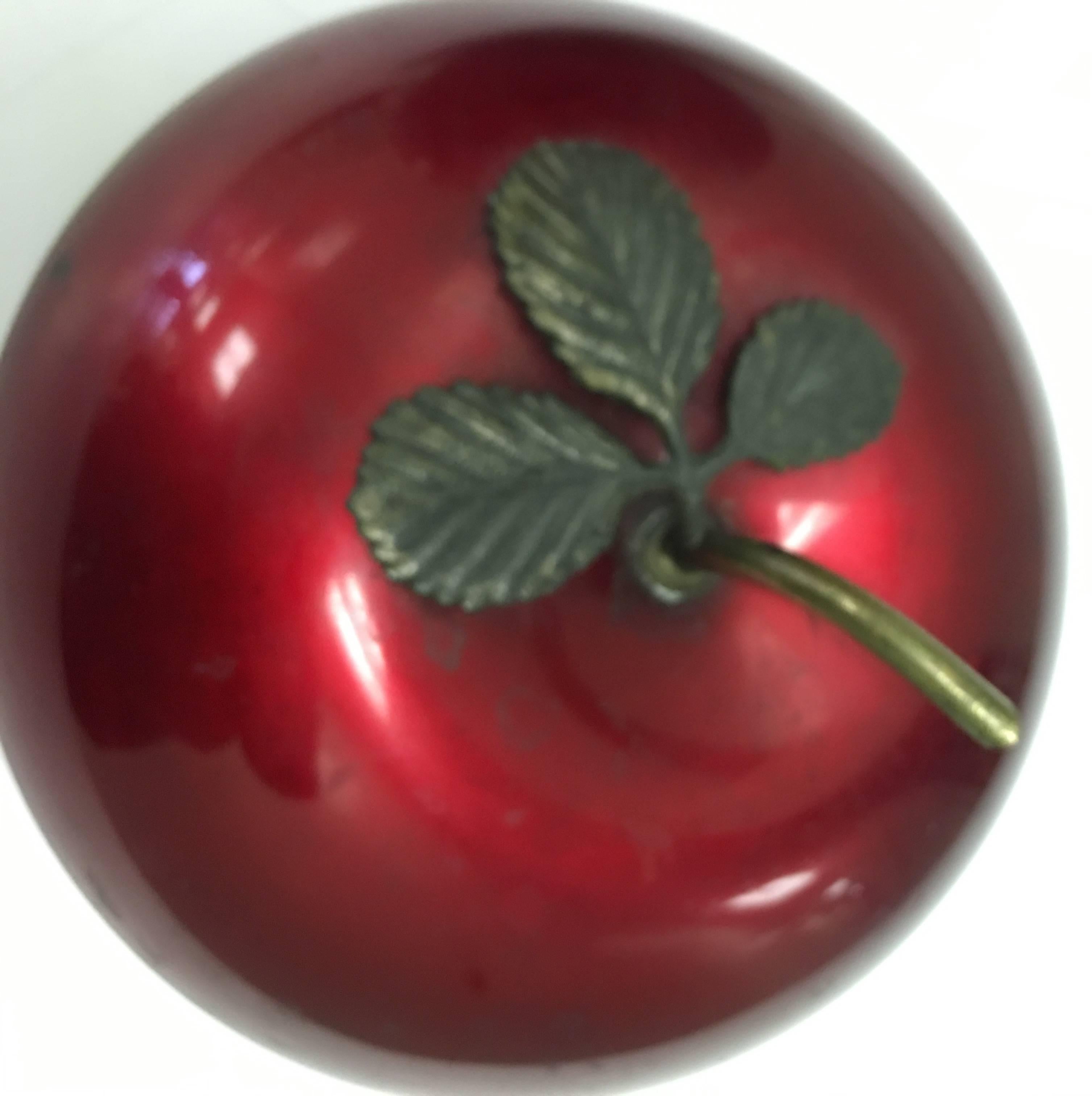 Mid-Century Modern red apple form ice bucket with a brass stem lid handle by Apollo Studios, New York.