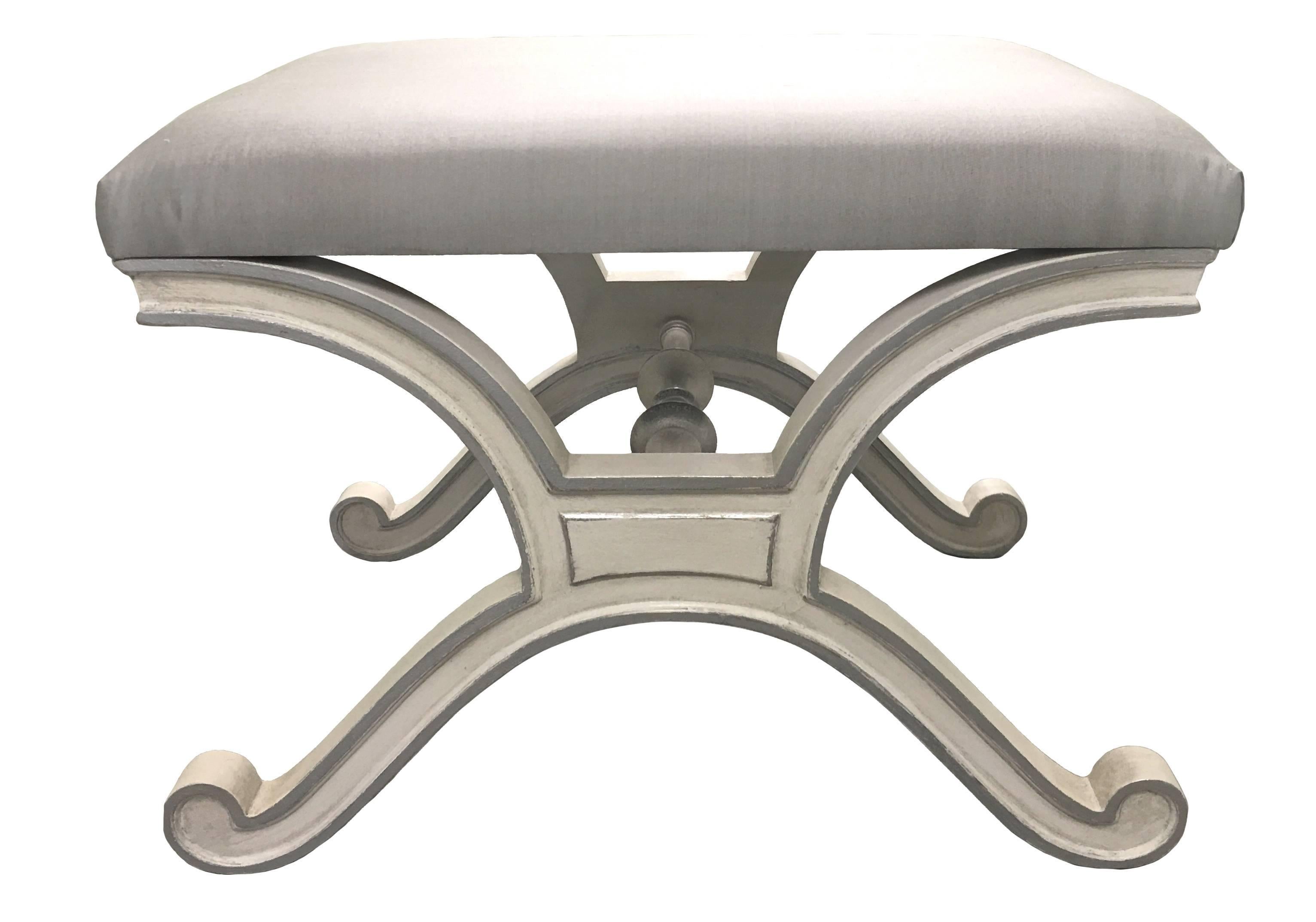 Pair of Dorothy Draper for Henredon Heritage Hollywood Regency style benches. Newly painted in an antique white finish with silver painted detailing. Newly upholstered in grey velvet fabric. Photos show an identical pair of (sold) benches in grey