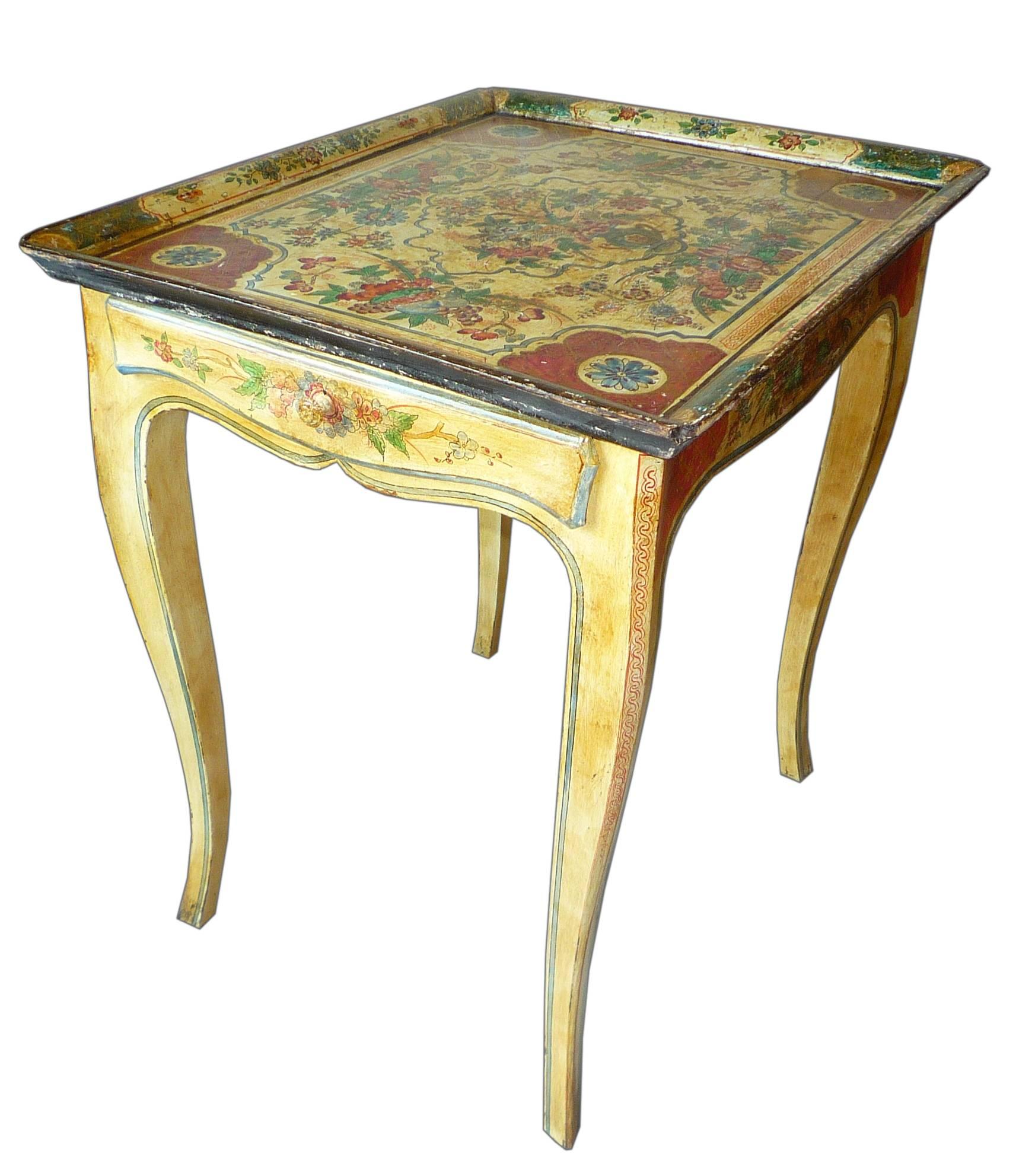 A small painted table, the decor of flowers in a vase. The tray is mid-18th century, from Venice, and the base is 1950s.