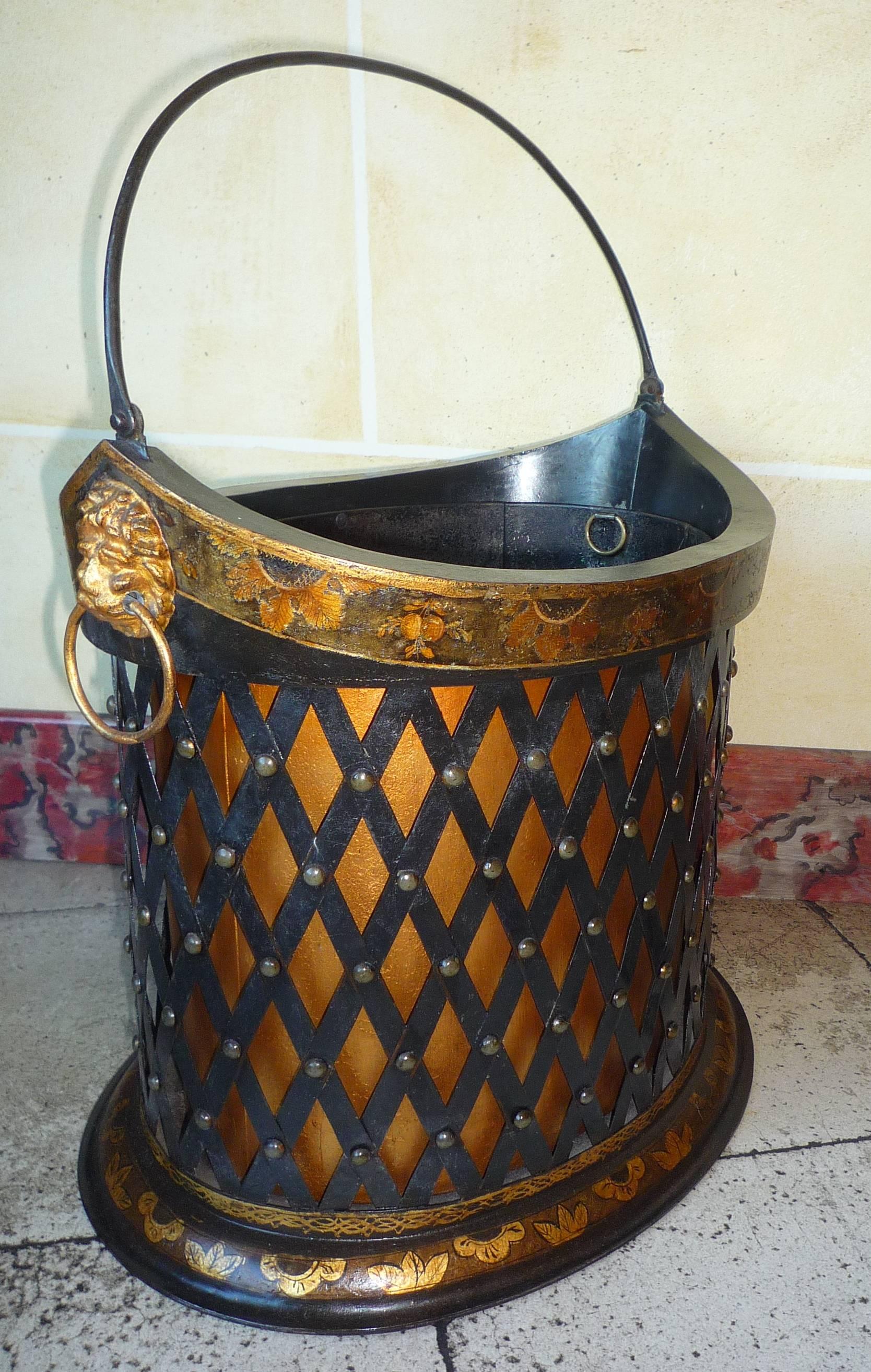 An English Regency period painted and gilt tole basket or coal bucket, the sides imitating trellis, circa 1810-1820.