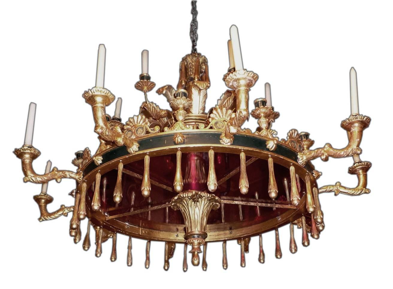 A fine and unusual Italian, Neapolitan neoclassical gilt and painted wood chandelier, with twenty-six-lights, circa 1815-1820.
