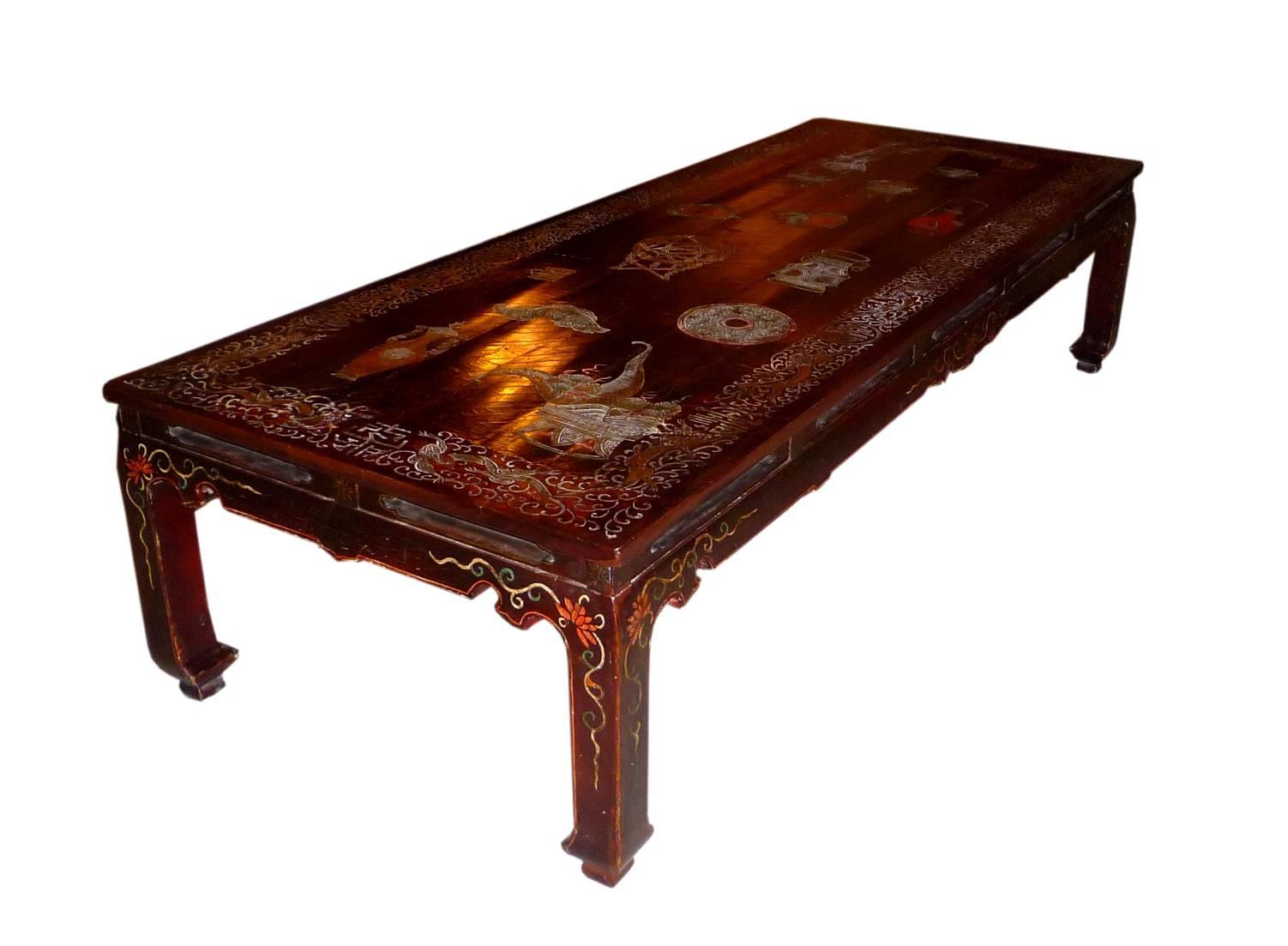 A French large and fine coffee table created, circa 1920-1930. The top tray is Chinese Coromandel lacquer panel with decor of vases and an armillary sphere (18th century.)