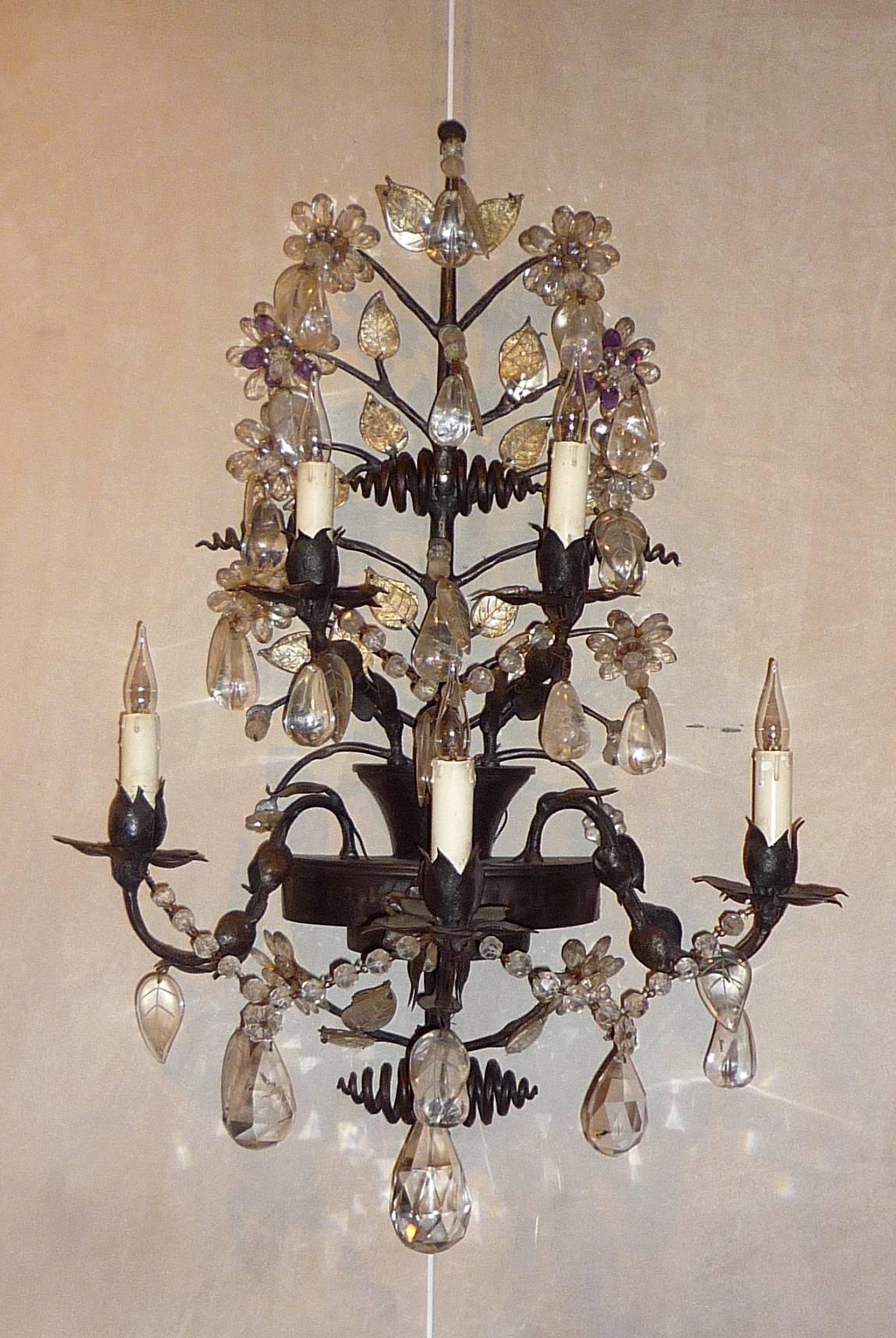 A pair of large French iron and rock crystal sconces, attributed to Maison Baguès, circa 1950 (special order for a private villa).