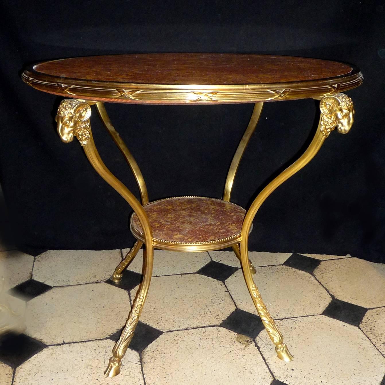 A pair of French Louis XVI style gilt bronze and Spanish brocatella marble tops gueridons, circa 1880. One marble top restored. 
From the Palais Rose, avenue du Bois, Paris, property of Anna Gould.
  