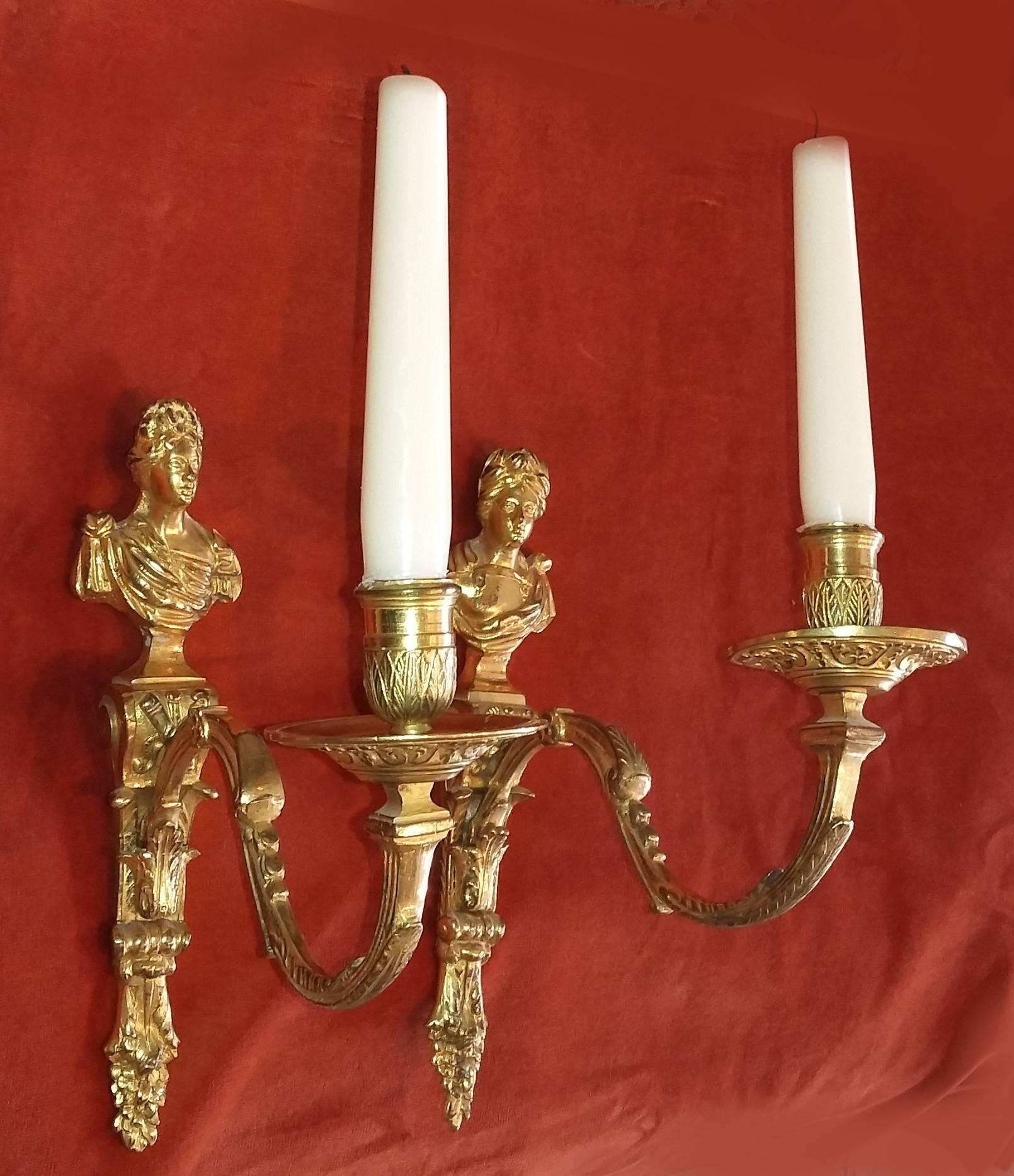 A pair of fine French Regence period gilt bronze wall lights showing Apollo and Diana, circa 1720.